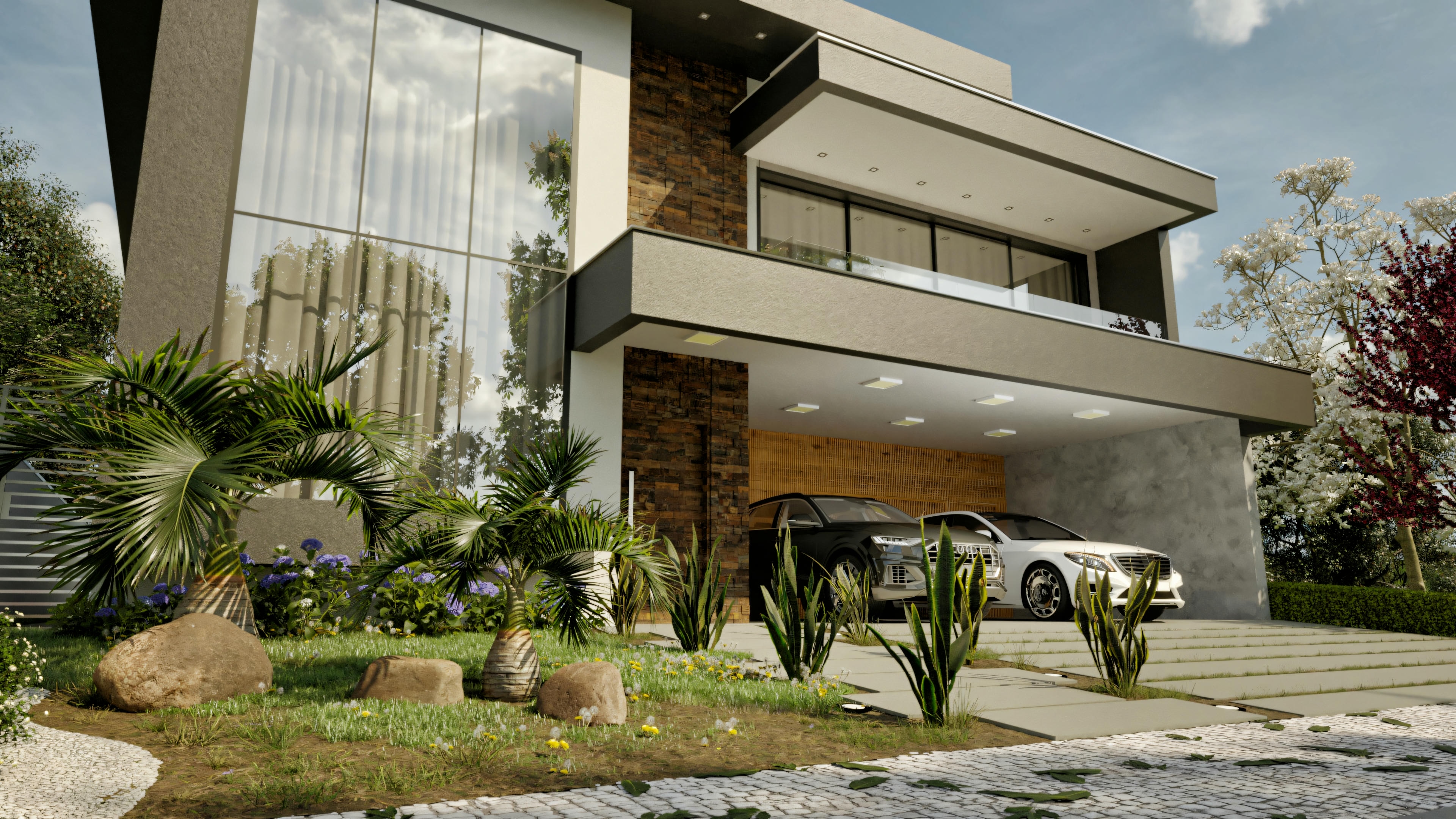 Detalle de la fachada moderna en casa de alto estándar con 5 suites, vista de día con foco en el paisajismo frontal incluyendo palmeras, piedras e iluminación de jardín. Exhibe revestimiento en piedra, vidrio y garaje doble.