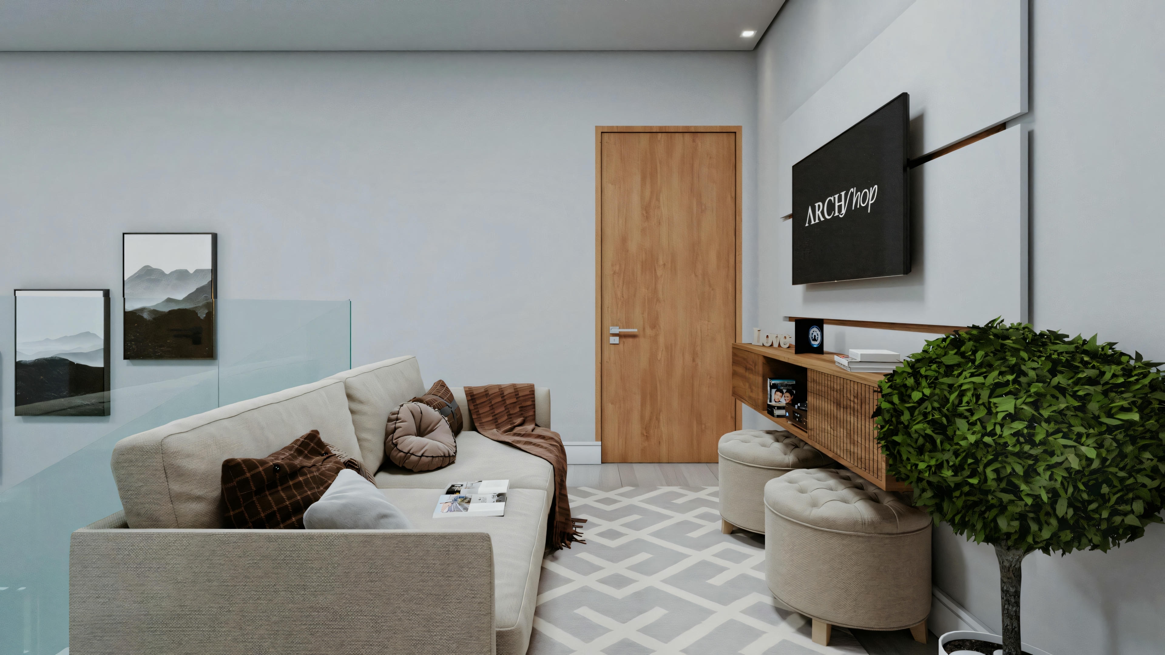 Another view of a modern living room with a gray sofa, a wooden console table under a wall-mounted television displaying “ARCH”, and a potted plant to the right.
