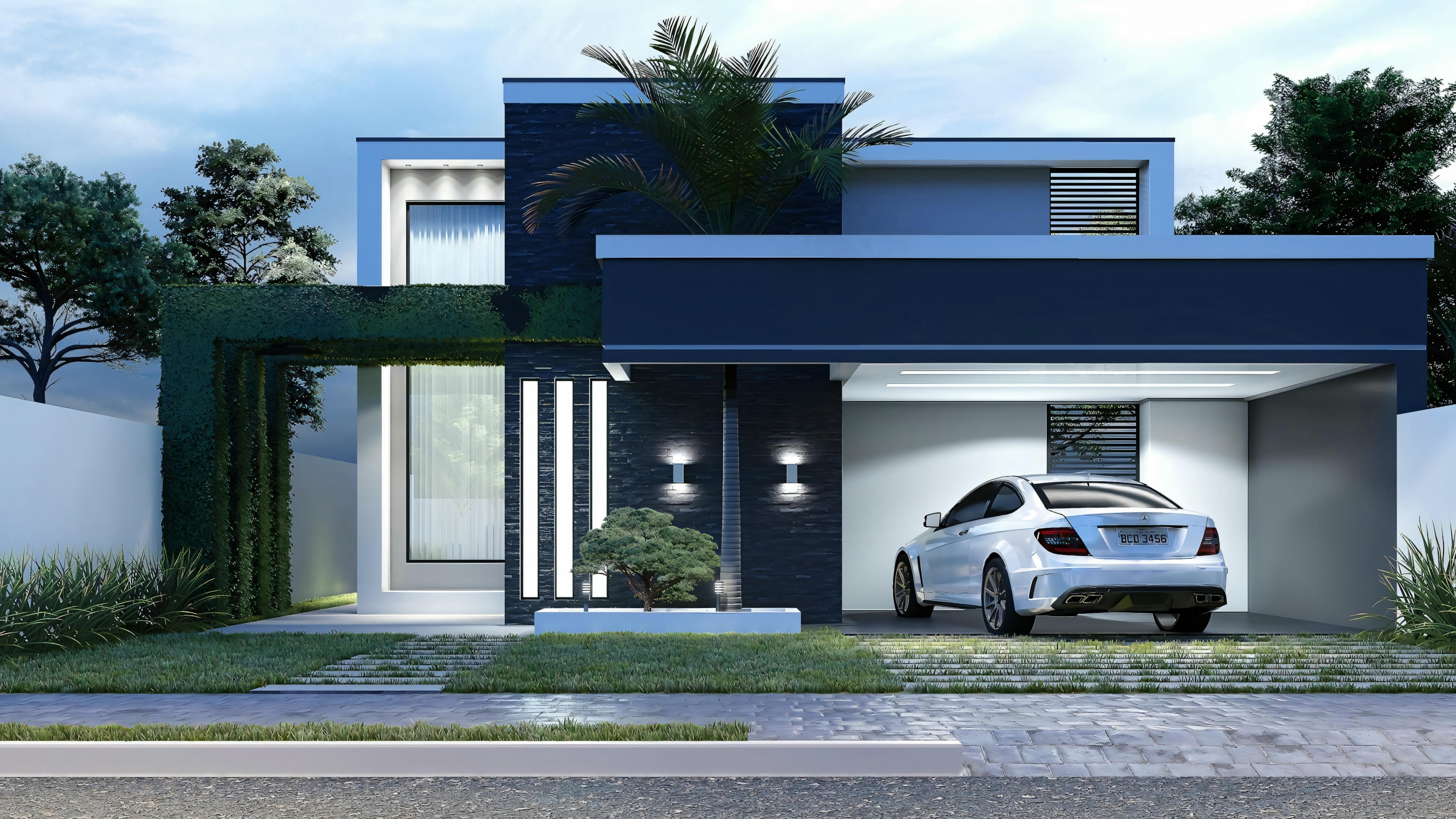 Exterior view of a modern house at dusk, with lights on and a car parked in front.