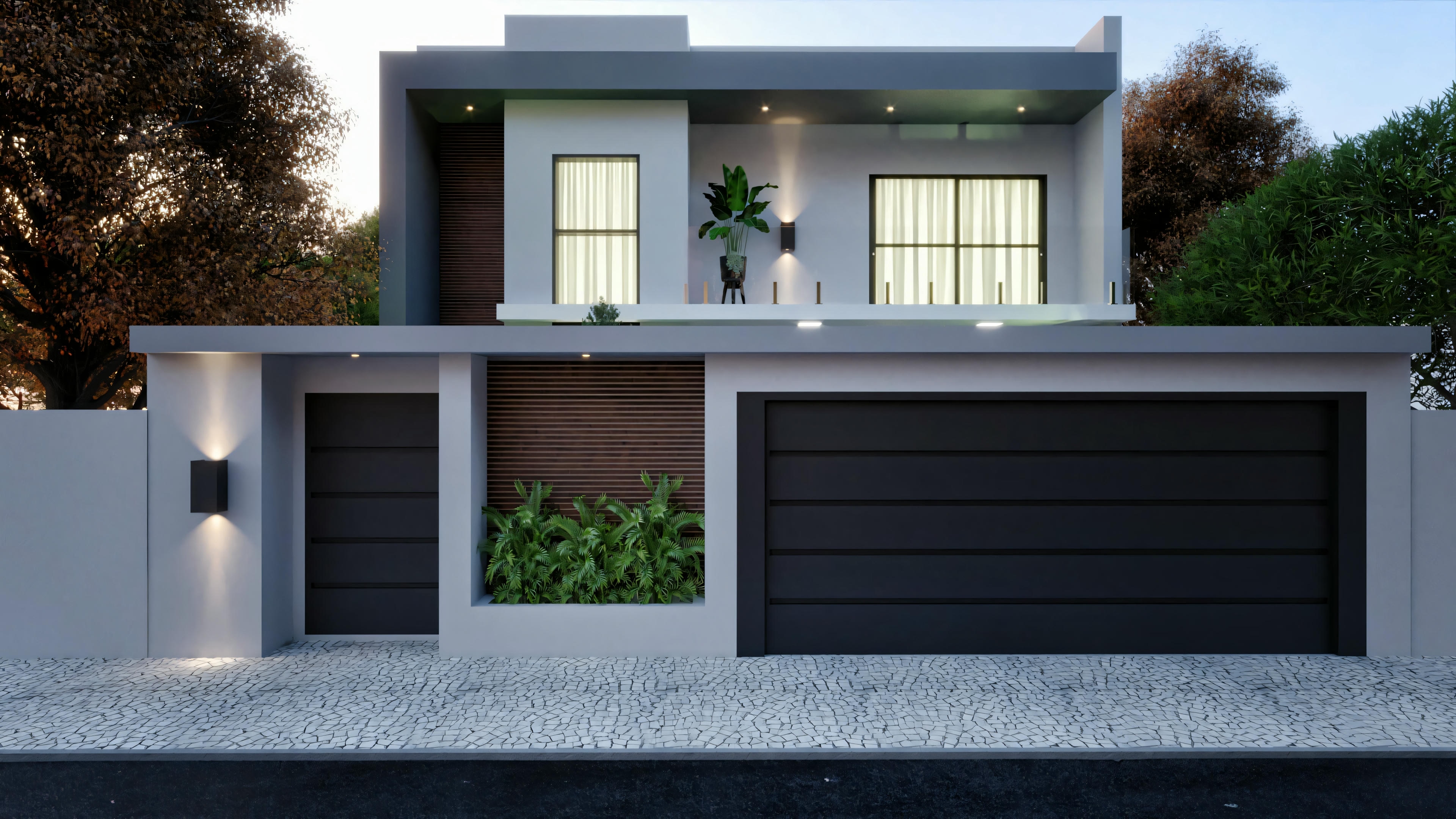 Una casa moderna durante la noche con luces interiores encendidas y puerta de garaje cerrada.