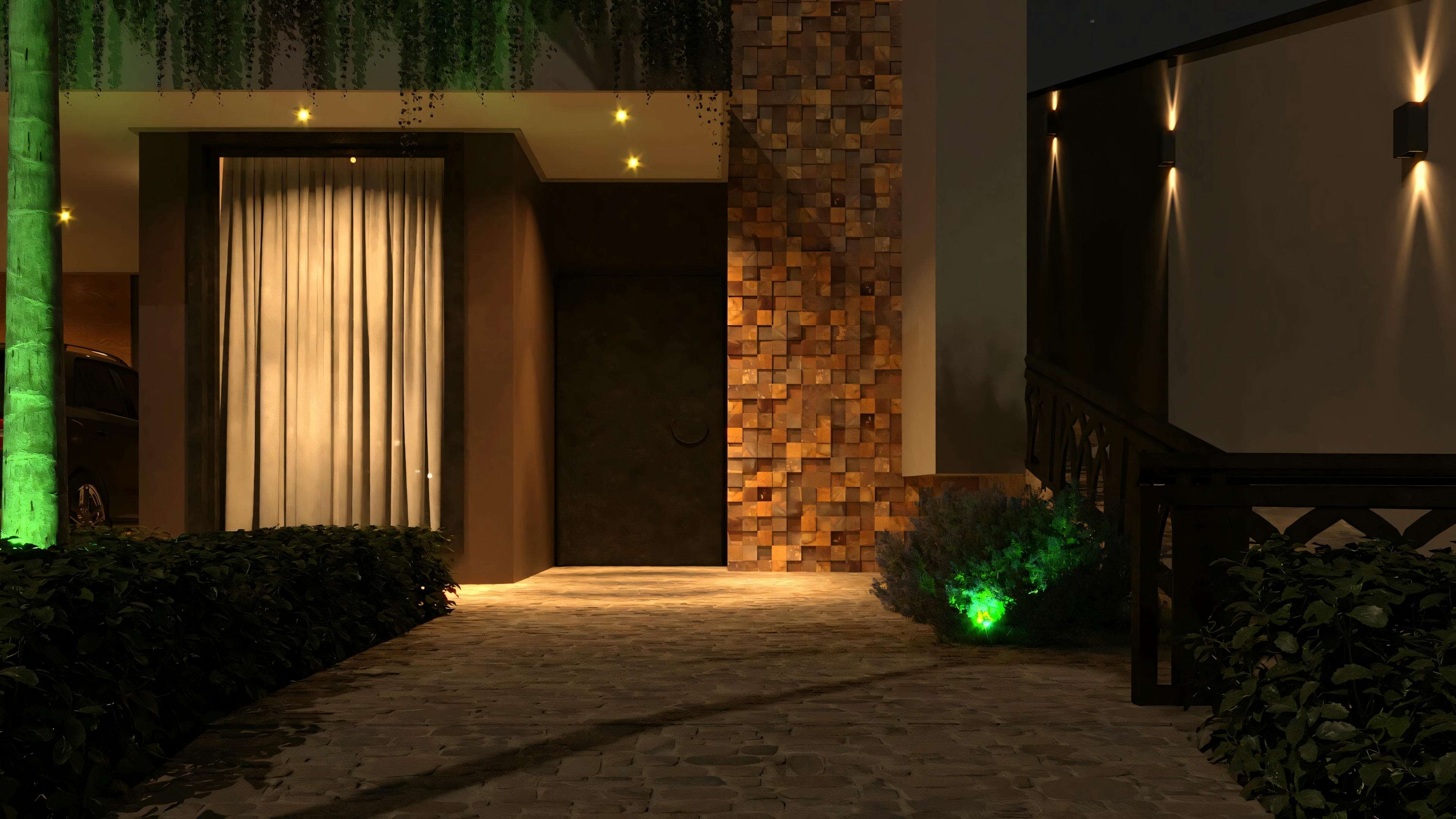 Entrada con escalera iluminada por luz verde.