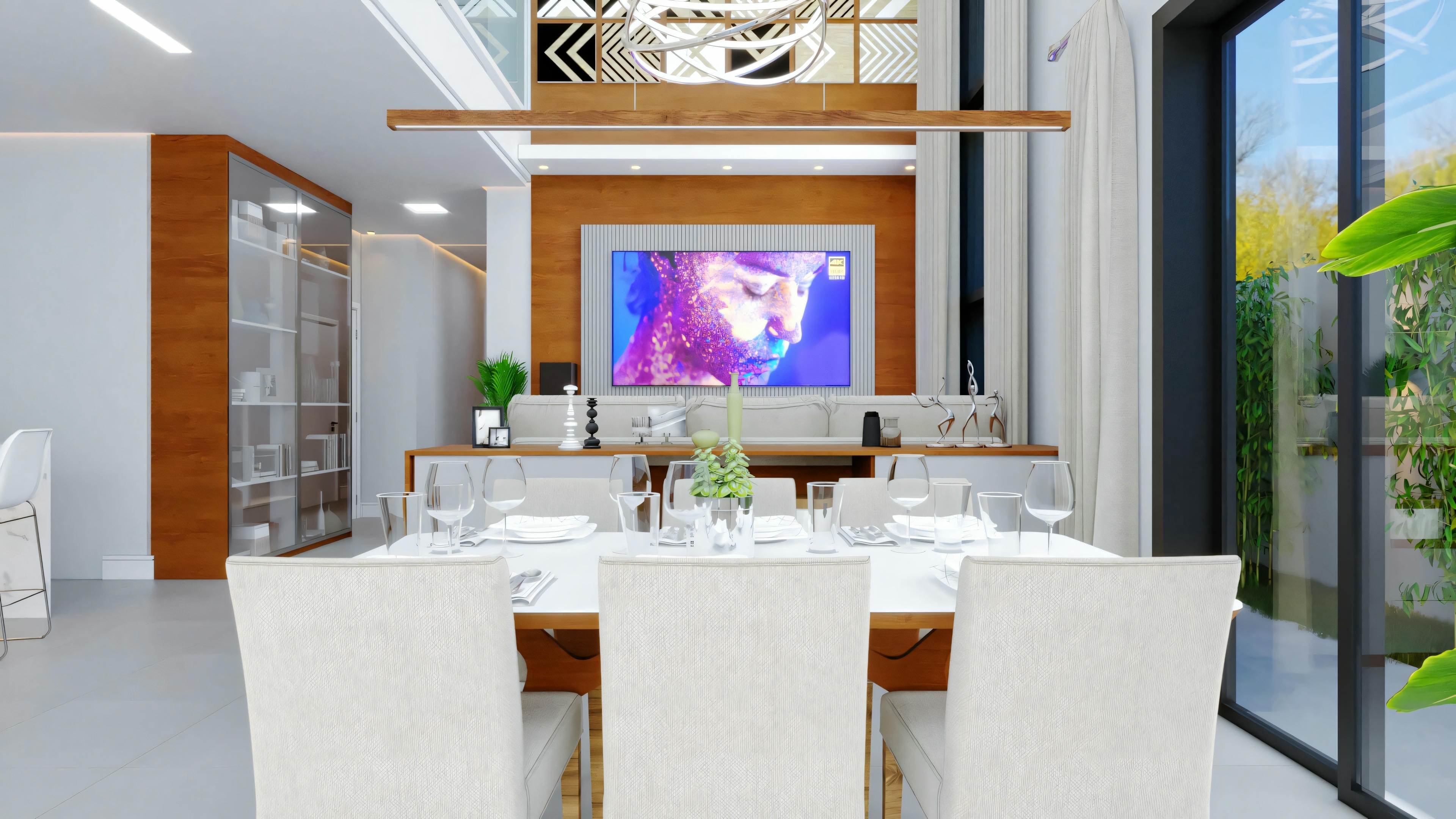 Un espacio de convivencia de plano abierto con un área de comedor en primer plano, presentando una mesa para seis personas, y una sala de estar al fondo con una gran pantalla de televisión mostrando una imagen.