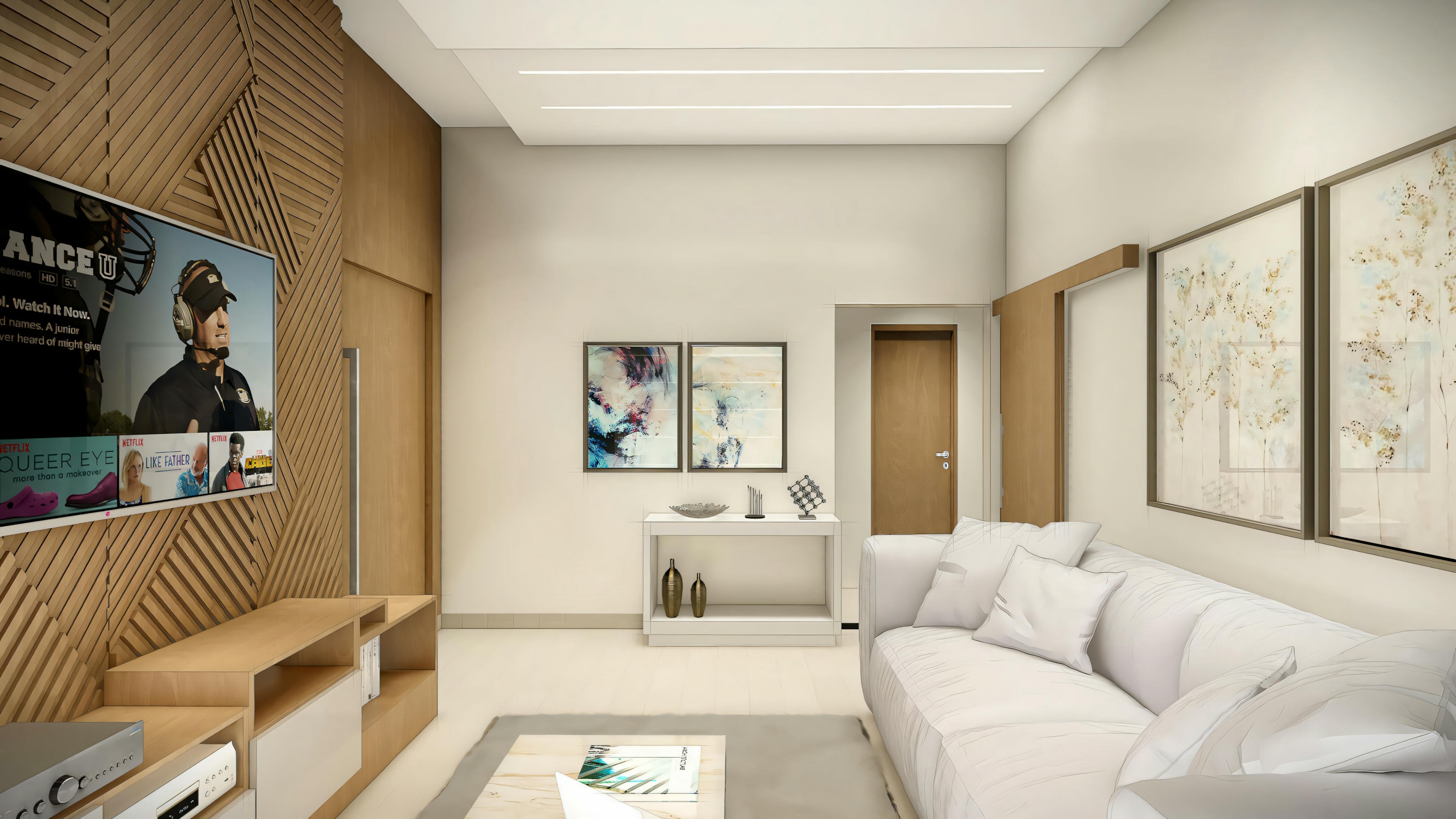 Sala de estar moderna con sofá, mesa de centro y televisión montada en la pared.