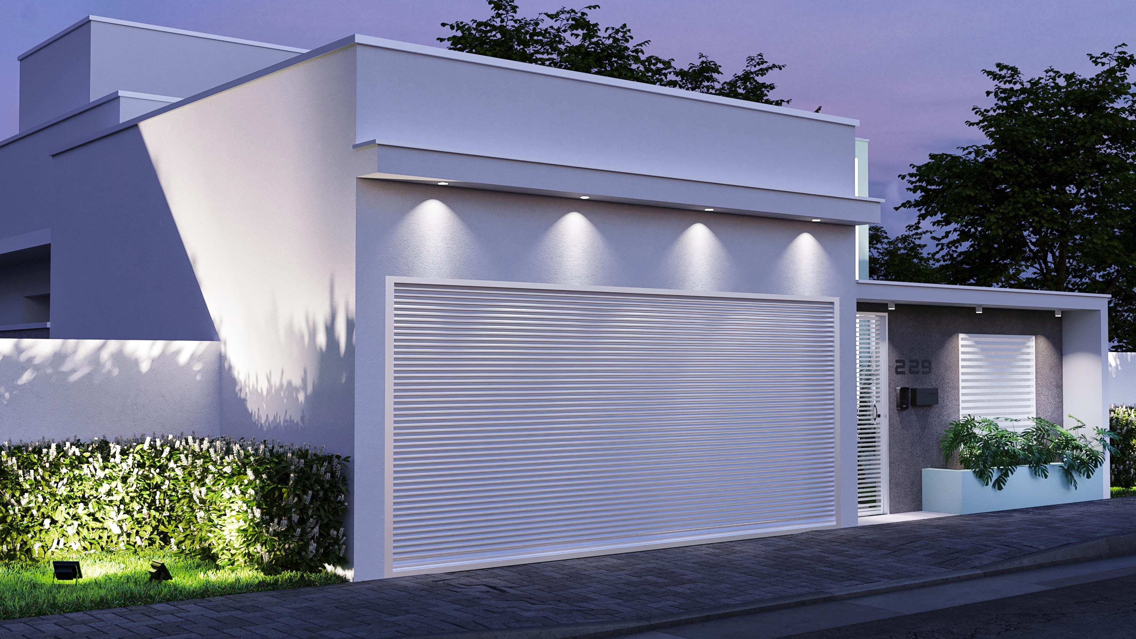 Facade of a single-story house with modern lines, combining smooth plaster textures and subtle details. Highlighted is the garage door with roller closure and built-in lighting.