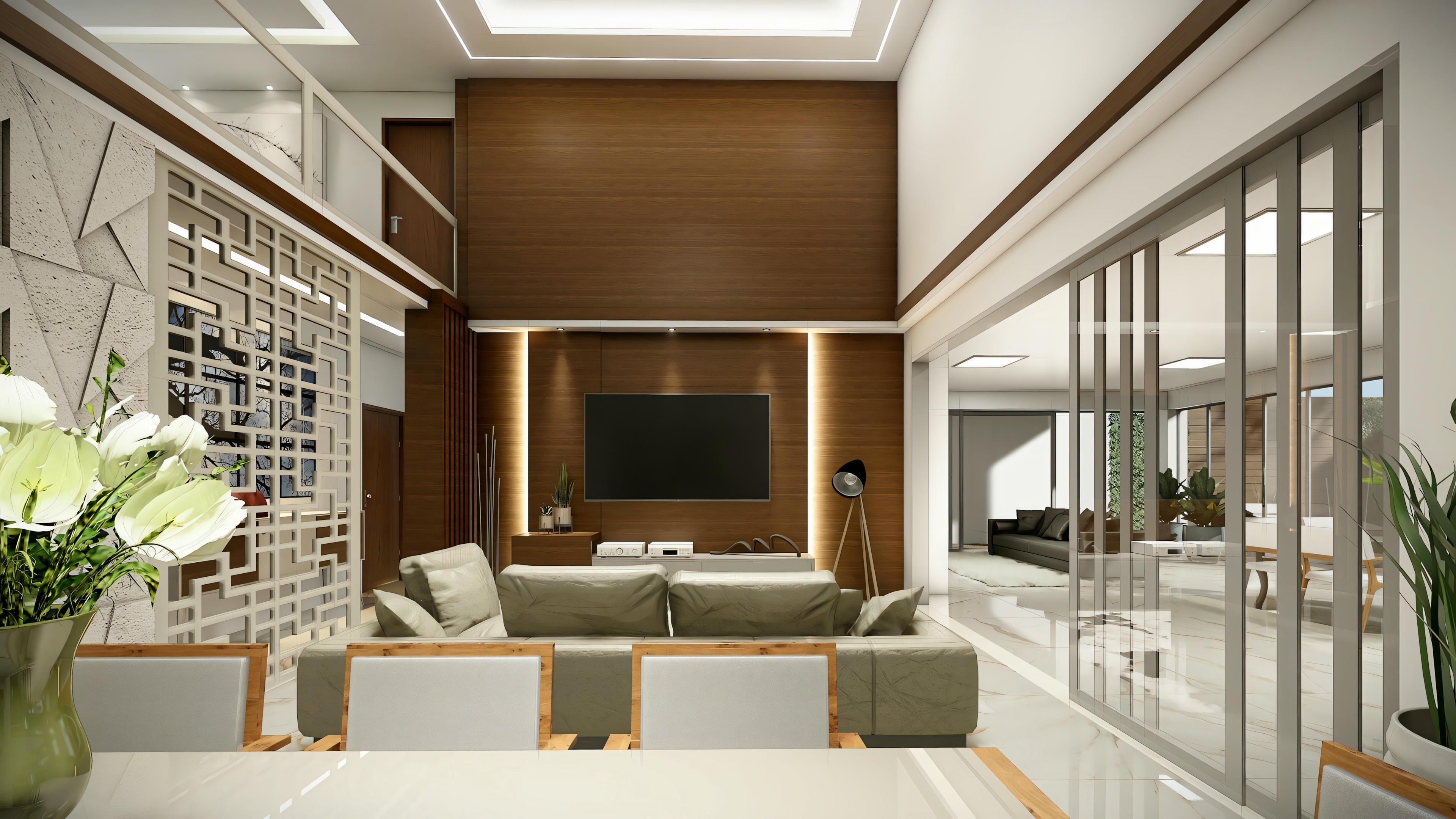 Sala de estar moderna com TV de tela plana montada na parede, sofá claro e poltronas combinando, mesa de centro retangular e planta interna.