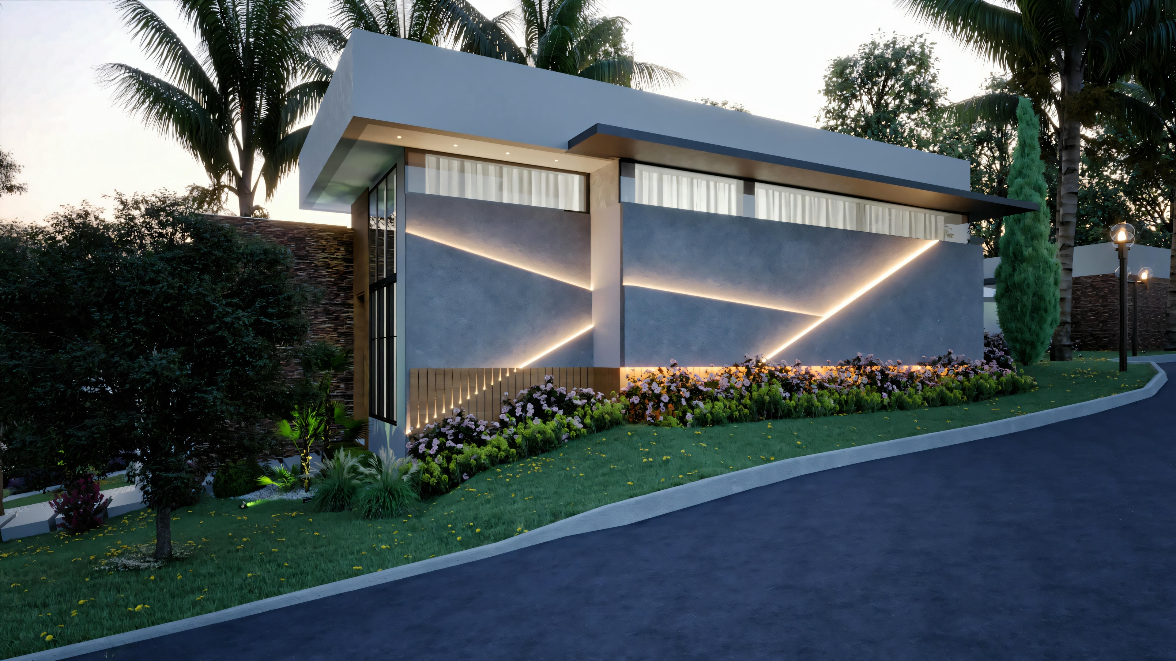 Casa moderna con tejado a dos aguas y puertas de garaje iluminadas, rodeada de jardín paisajístico.