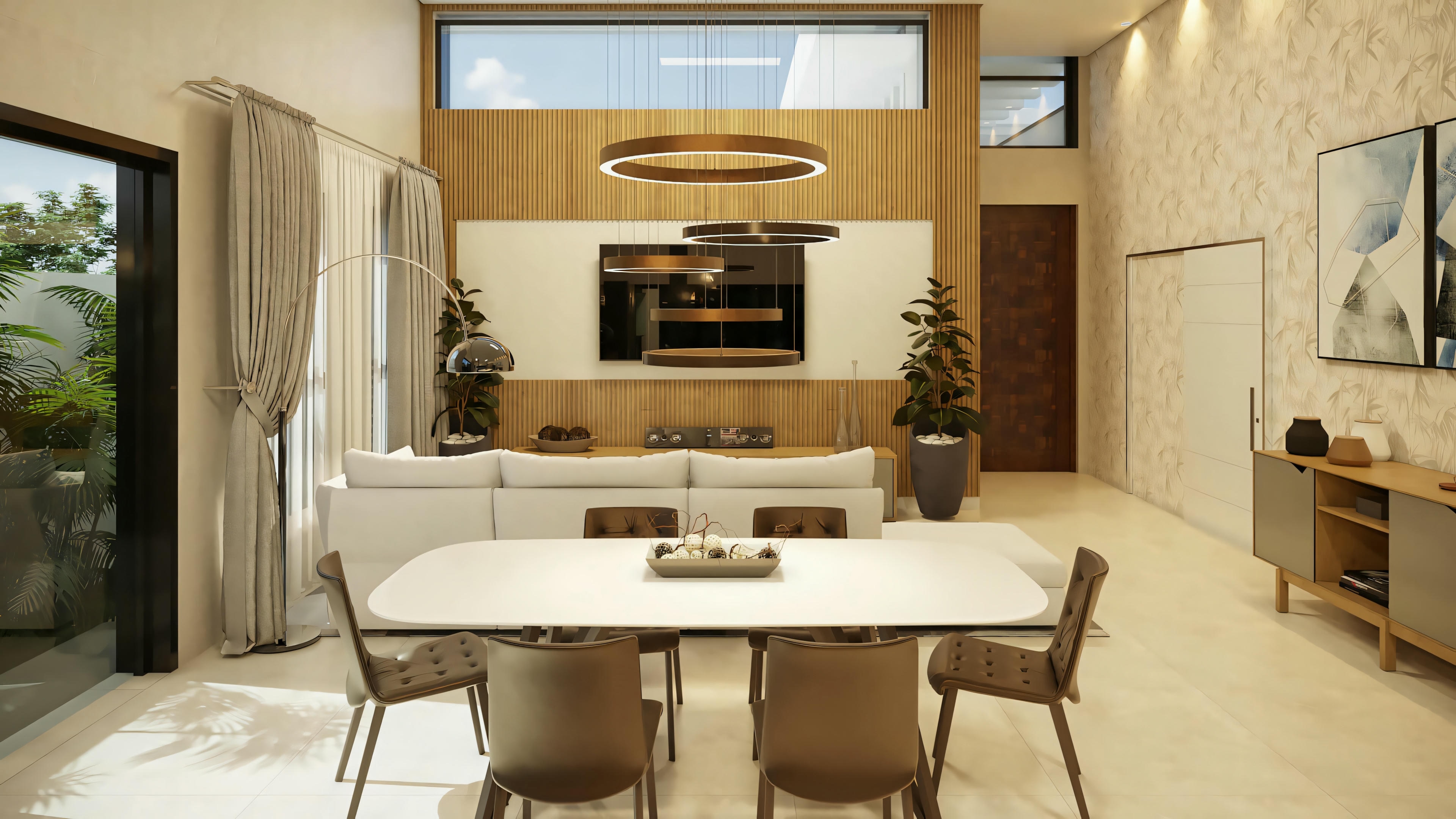 Cozinha com ilha central, bancadas brancas e luminárias pendentes.