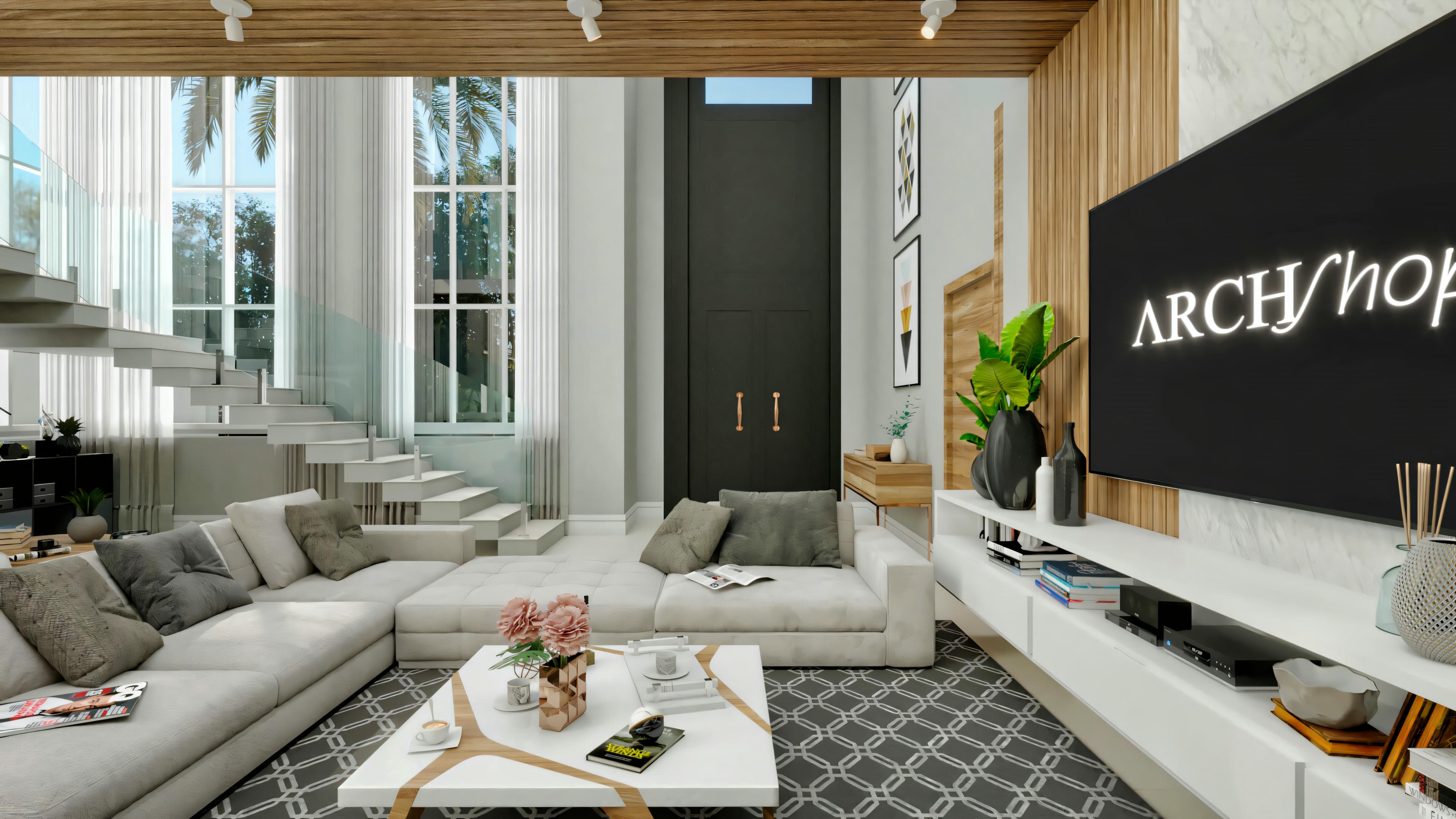 Interior view of the modern living room in a neoclassical house, showing sofa, TV panel, floating staircase, and tall entrance door in the background.