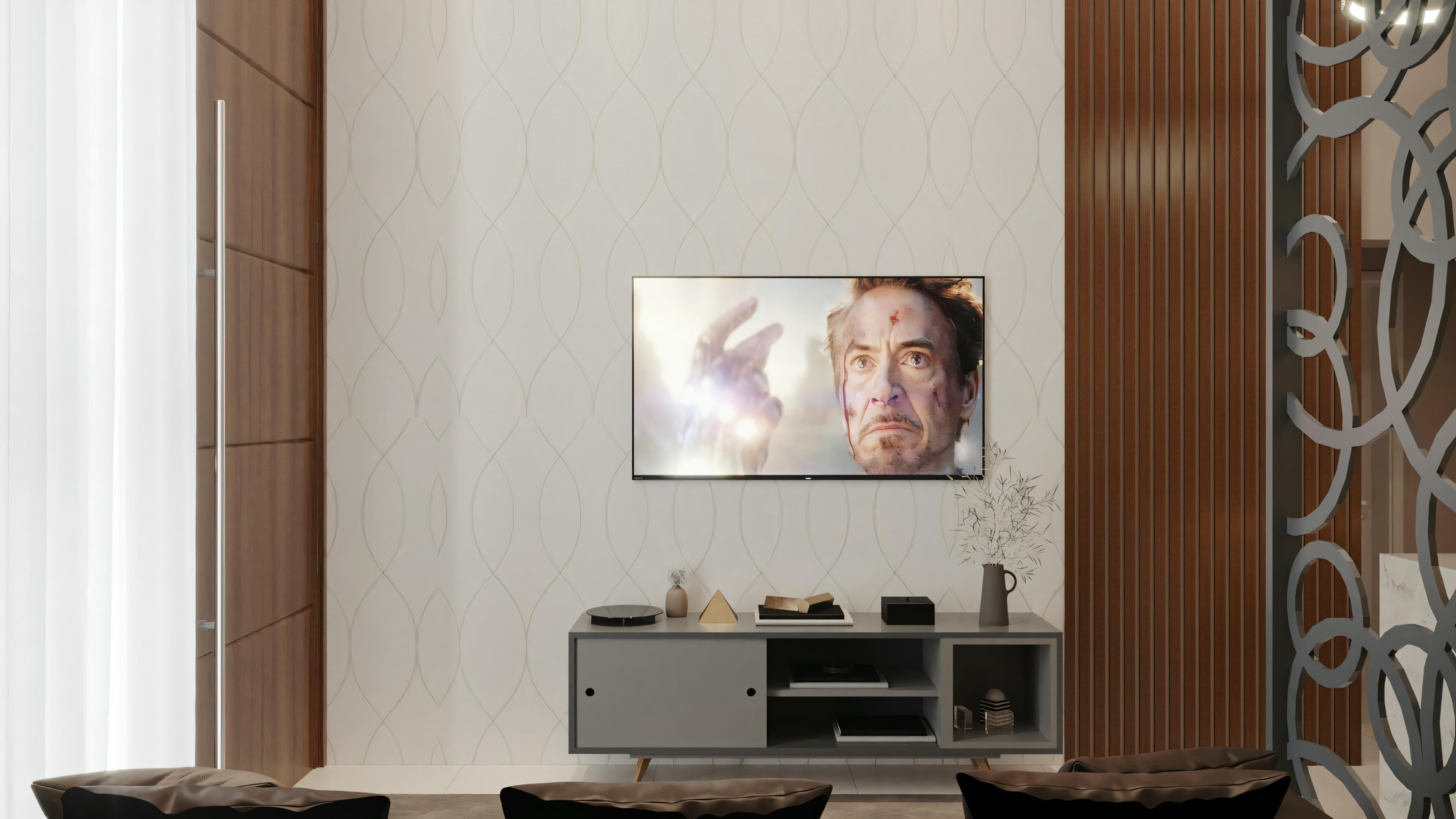 Living room with a wall-mounted television, a small cabinet below, and part of a curtain visible on the right.