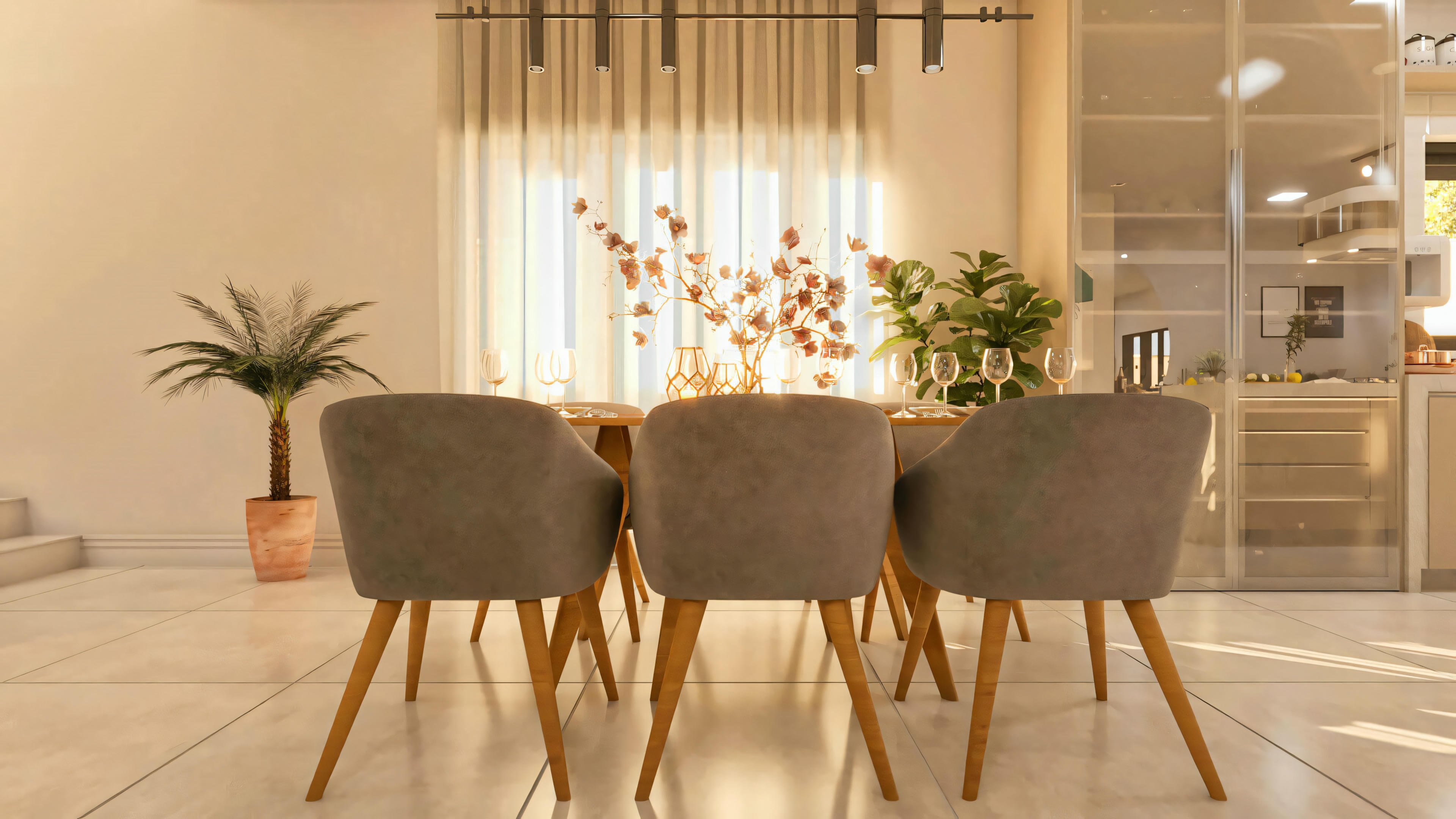 Detalle de la sala de comedor de la casa de dos pisos moderna en terreno 10x25, con foco en las sillas tapizadas y la mesa puesta. Ambiente interno con diseño contemporáneo y vista parcial de la cocina/armarios.