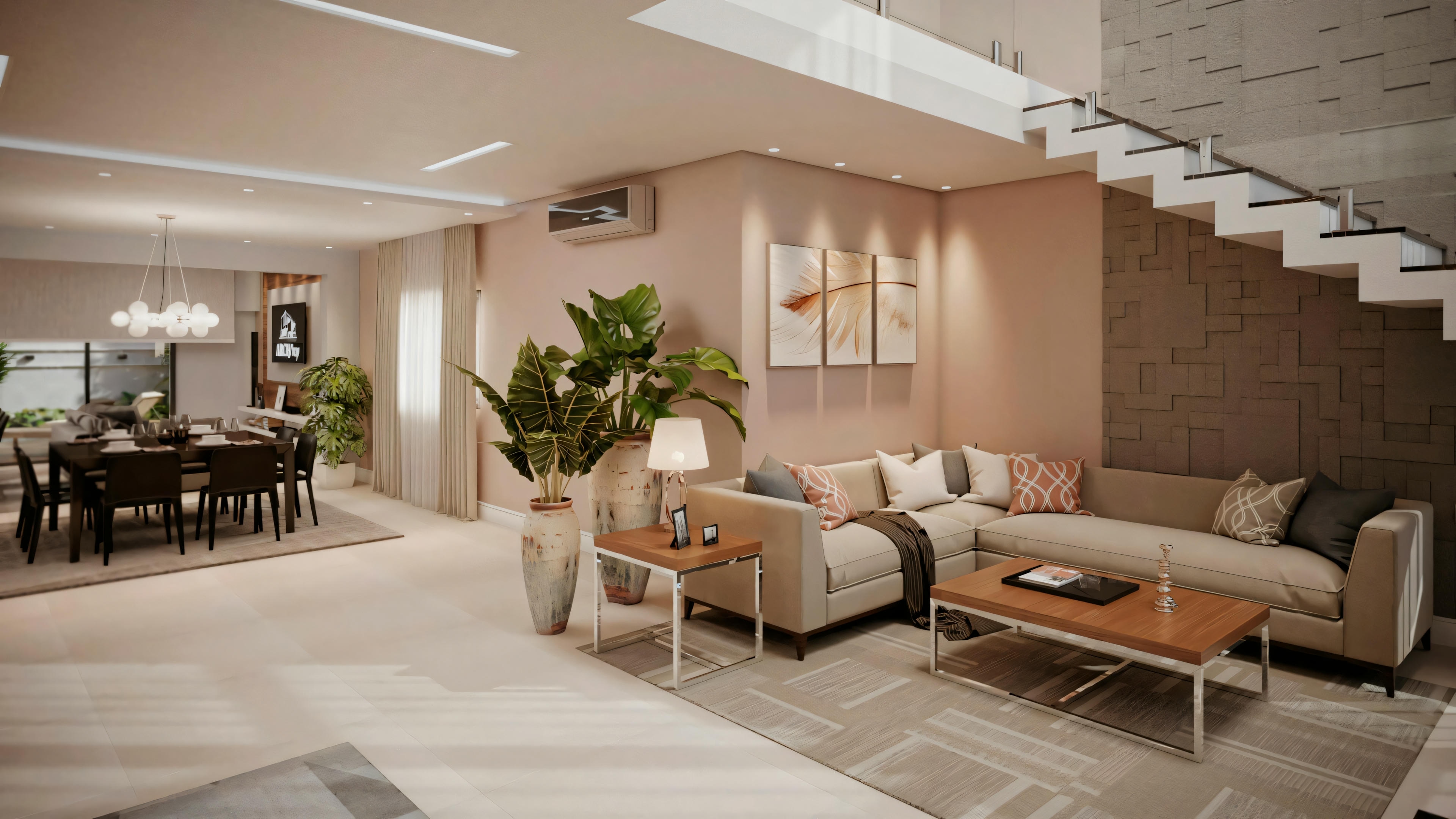 Una sala de estar con sofá beige, sillones y mesa de centro, con un comedor al fondo. Las paredes están pintadas en rosa claro y blanco, y hay una escalera a la derecha que conduce a otro nivel.