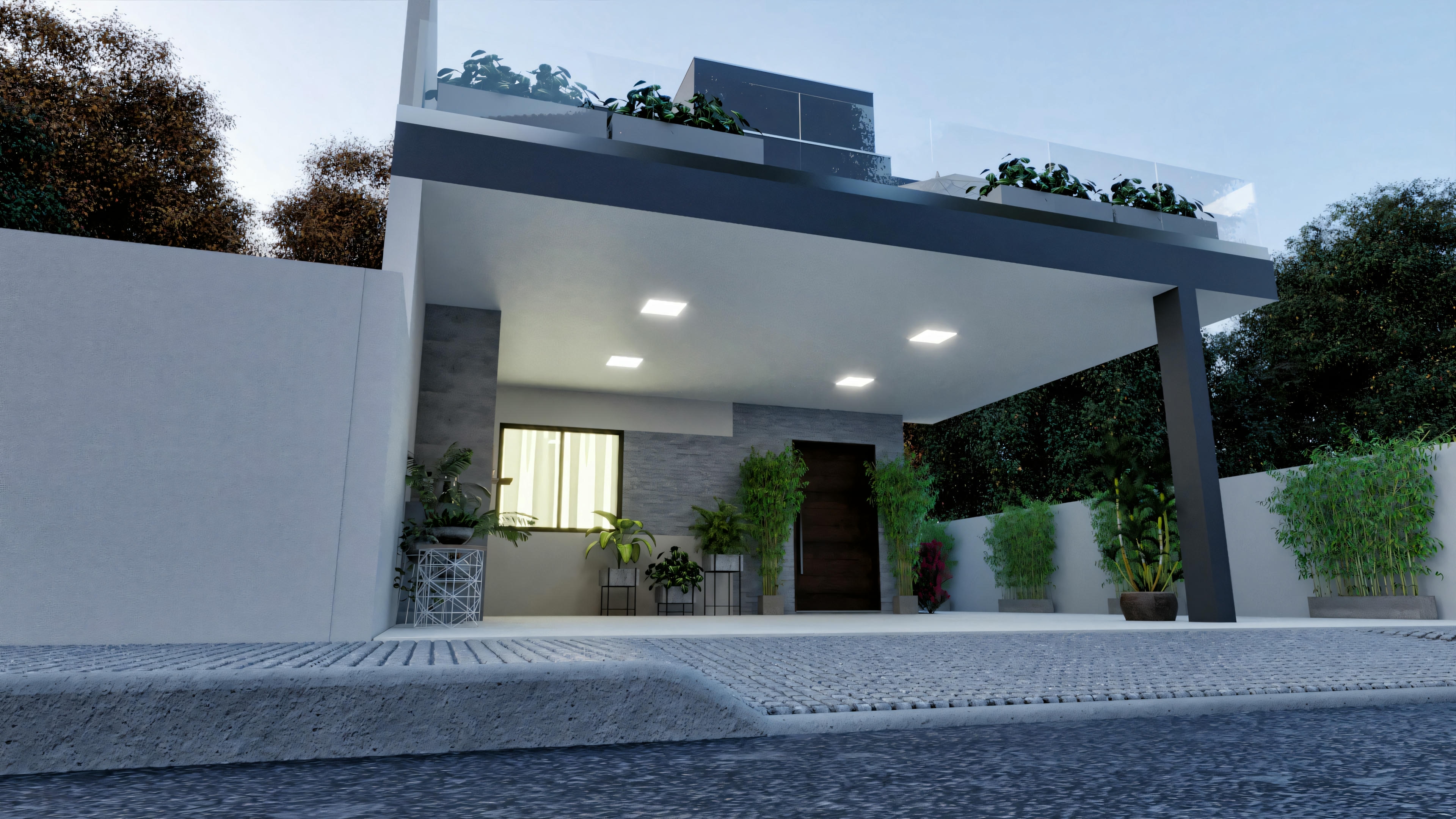 A modern house at dusk with interior lights on, highlighting a large garage door and a well-lit entrance area.