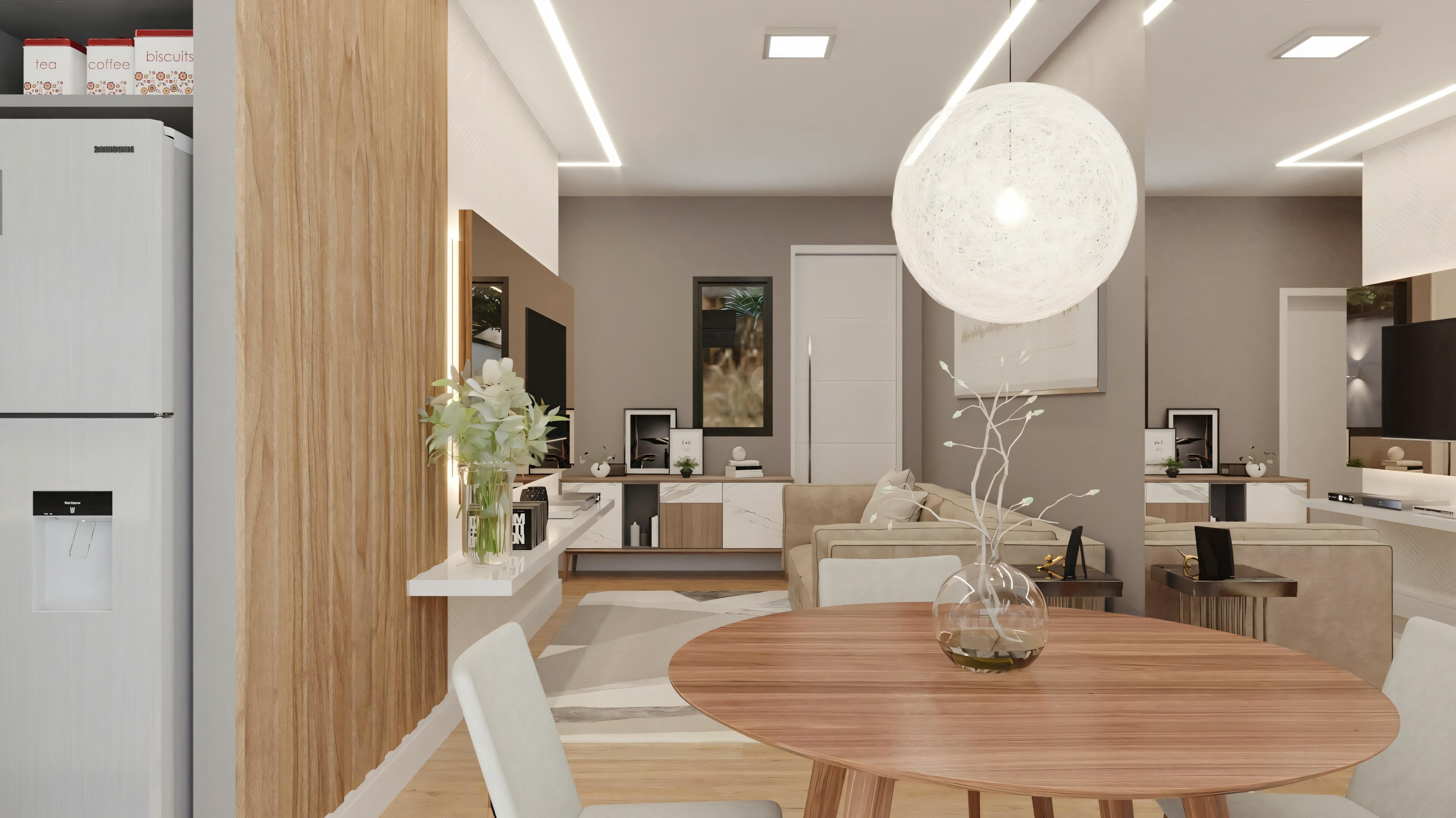 Internal view of a modern kitchen and dining area with a round table, chairs, and pendant lighting fixtures.