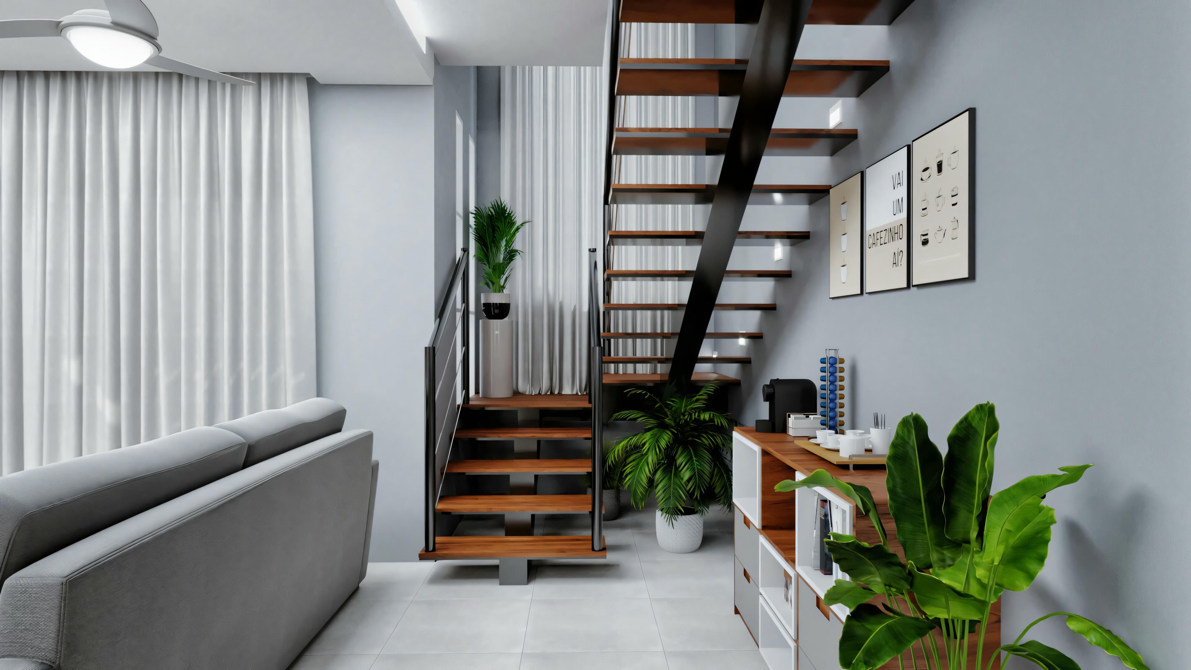 Modern living room with gray sofa, white curtains, wooden staircase leading to the upper floor, and several plants.