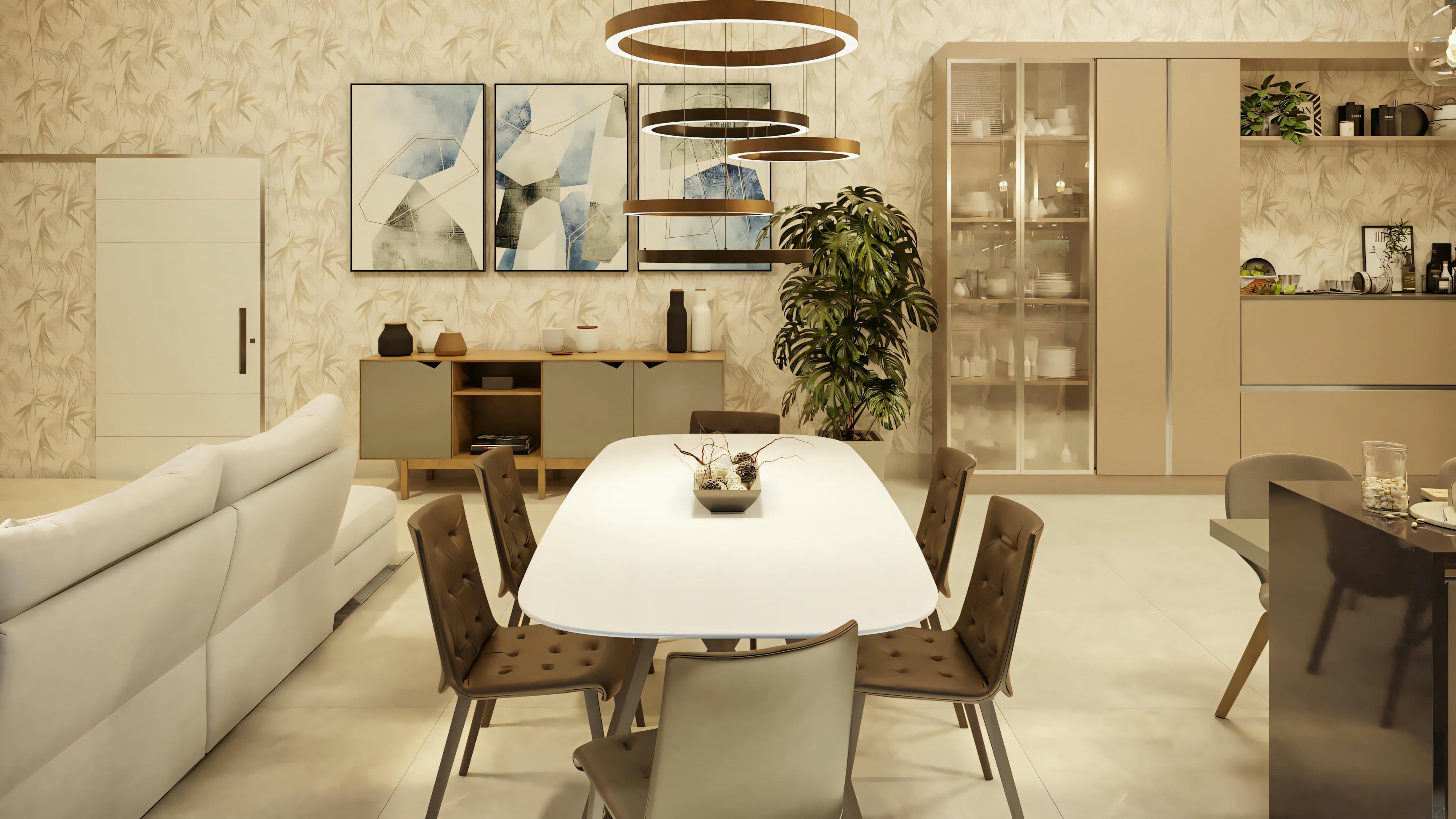 Dining area with a white round table and chairs, with a kitchen in the background.