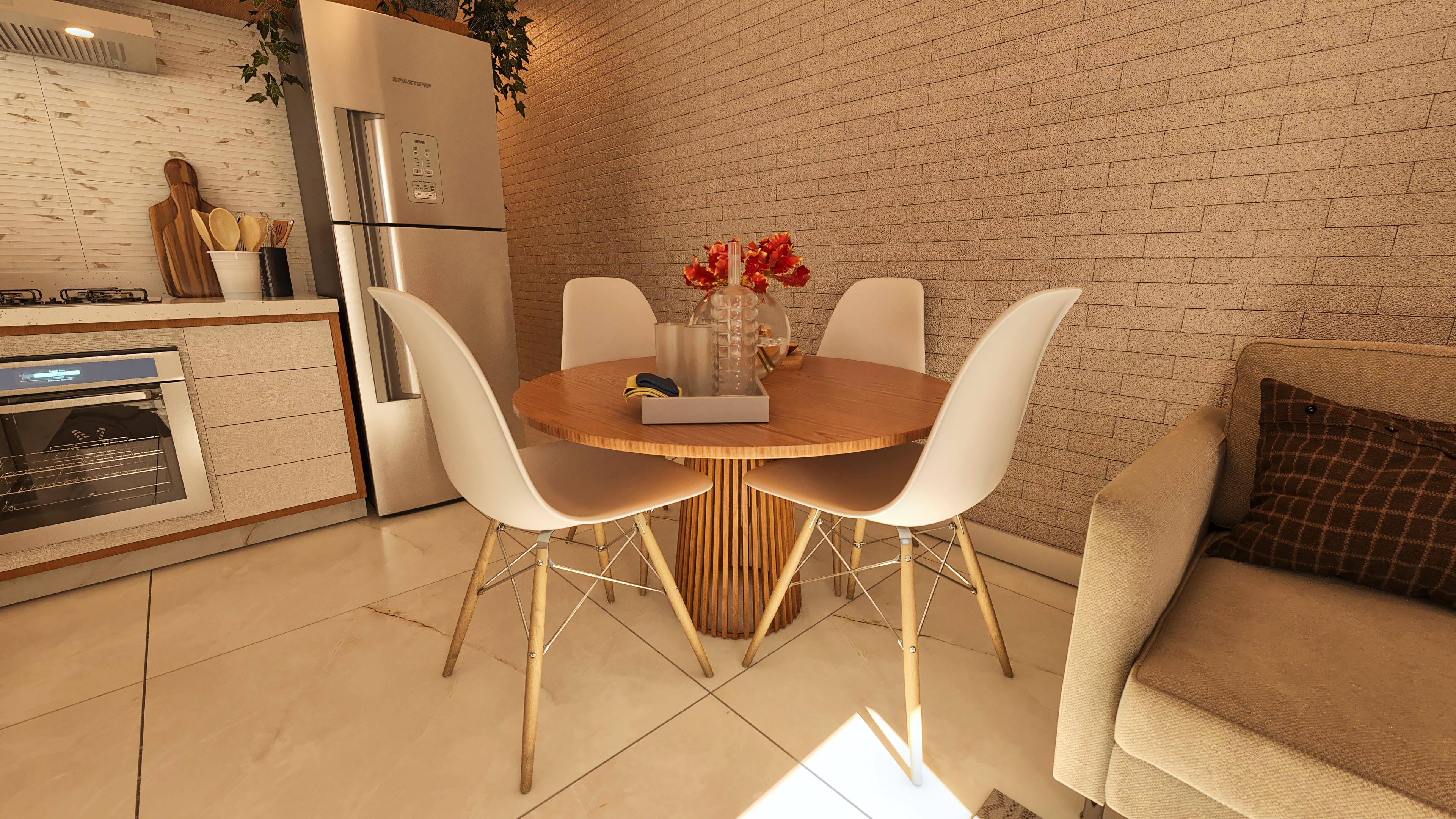 Detail of the kitchen integrated with the dining room, featuring cabinets with a light wood finish, a built-in oven, and a wall clad in light exposed bricks. Round wooden table with white chairs.