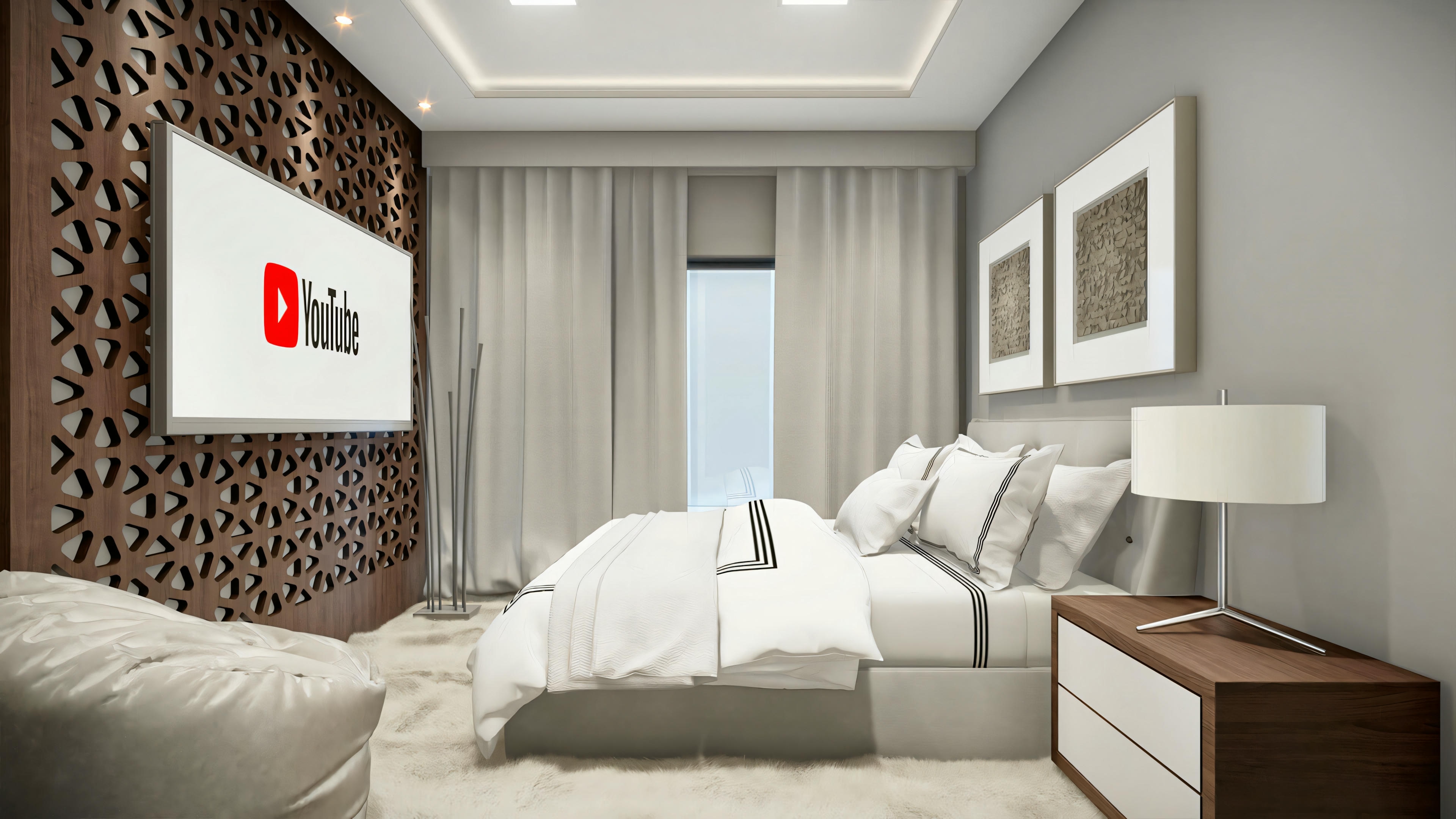 A bedroom with neutral tones, decorative pillows on the bed, and artwork on the wall.