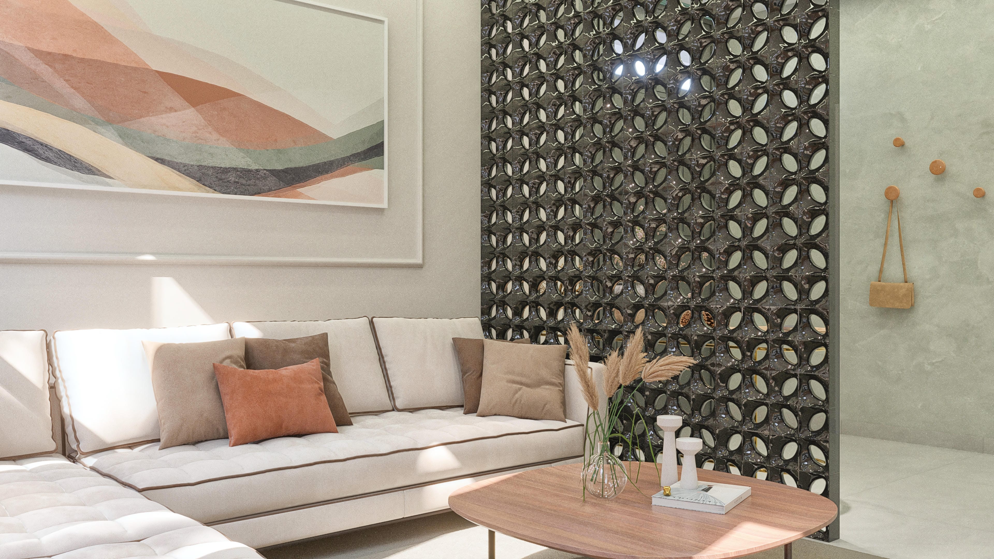Ambiente interior sofisticado con sofá en L beige, detalles en capitoné y cojines en tonos terrosos. Pared con revestimiento 3D espejado y obra de arte abstracta.