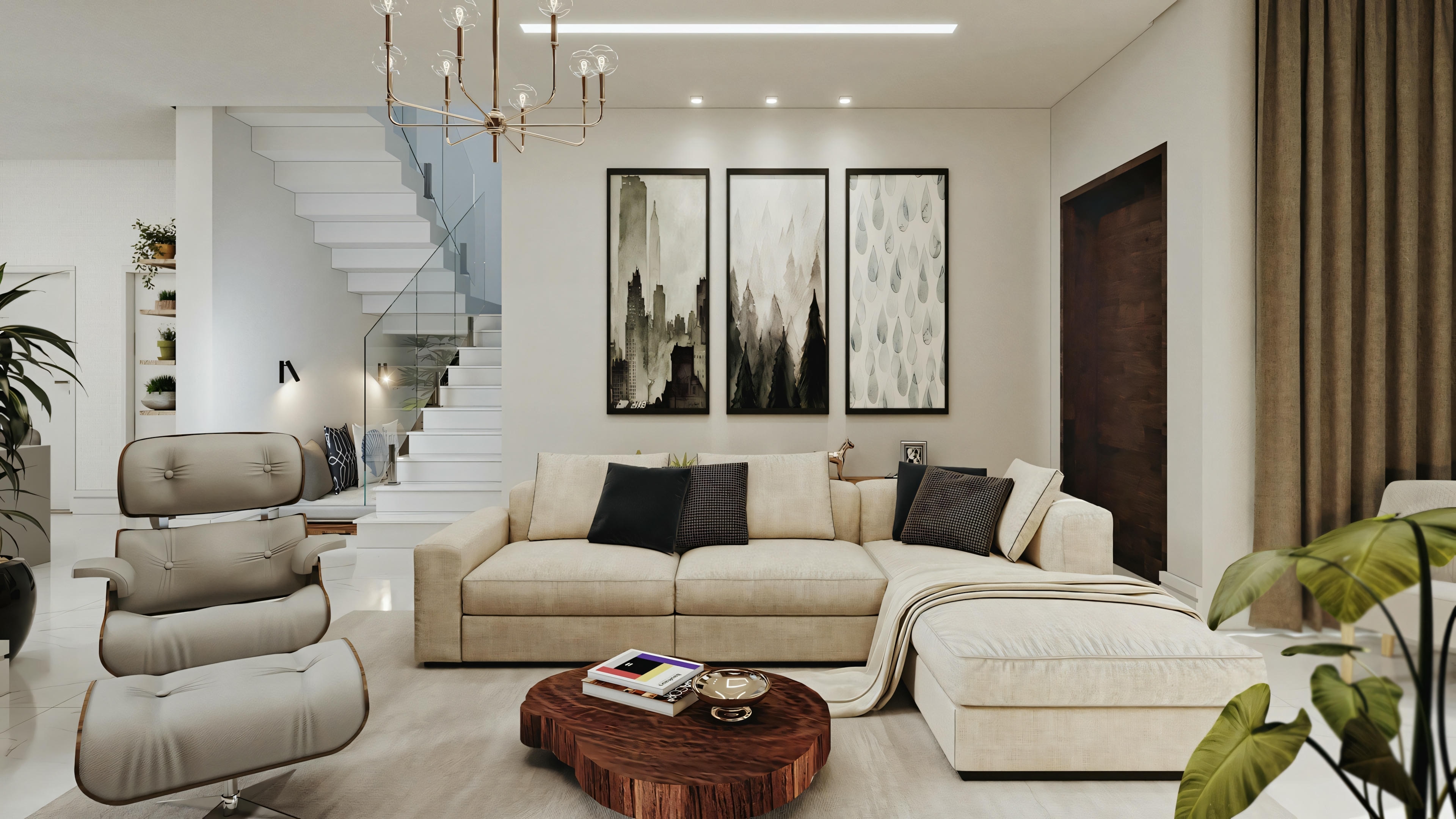 Un salón moderno con una paleta de colores neutros. Hay un sofá seccional, un sillón y una mesa de centro de madera con libros encima. La sala presenta elementos decorativos como arte en las paredes, plantas y una escalera que lleva a otro nivel.