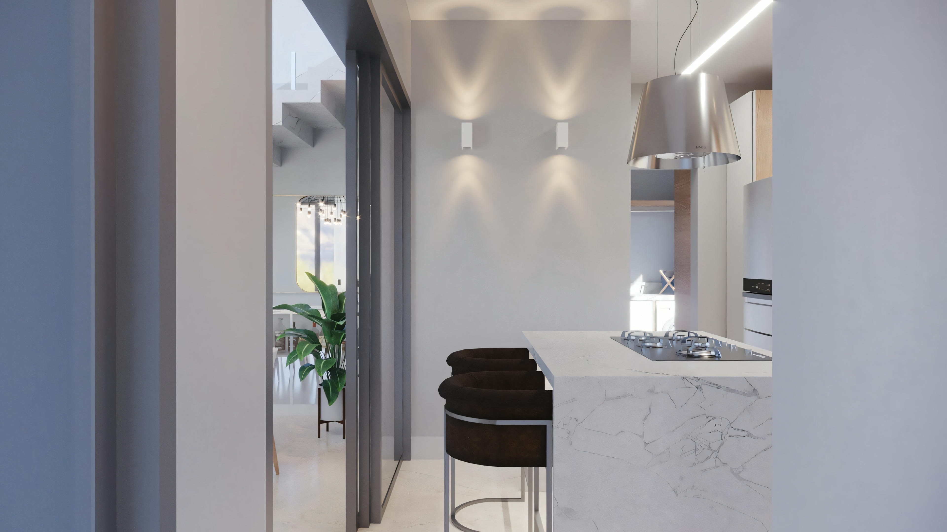 Vista interior de un área posiblemente de cocina o bar, con lámparas colgantes sobre un mostrador y banquetas altas, reflejando un diseño contemporáneo.