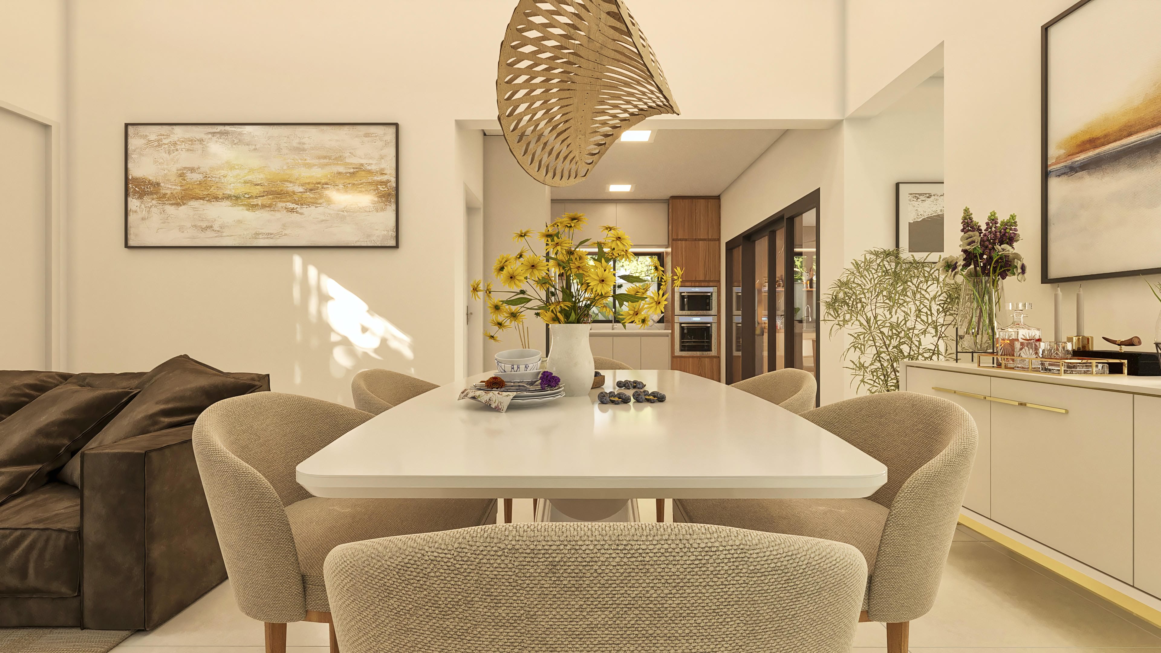 Visión interna de casa moderna, destacando la integración entre el comedor con mesa blanca y sillas en tonos neutros, y la cocina planificada con armarios de madera y electrodomésticos empotrados. Una lámpara de araña escultural en madera complementa el ambiente.