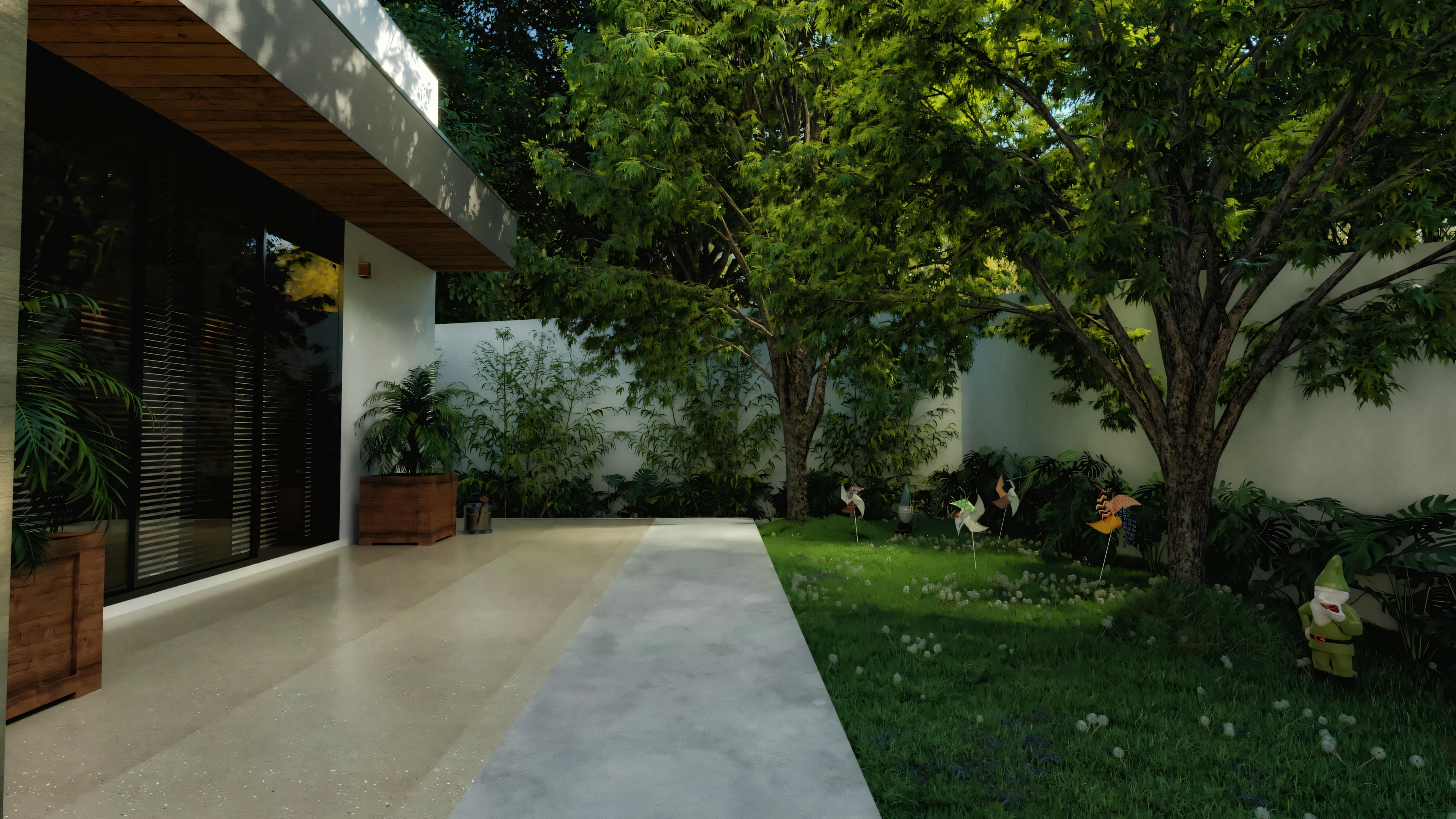 Outdoor area of the country house with a concrete path, grassy garden, and various trees and plants.