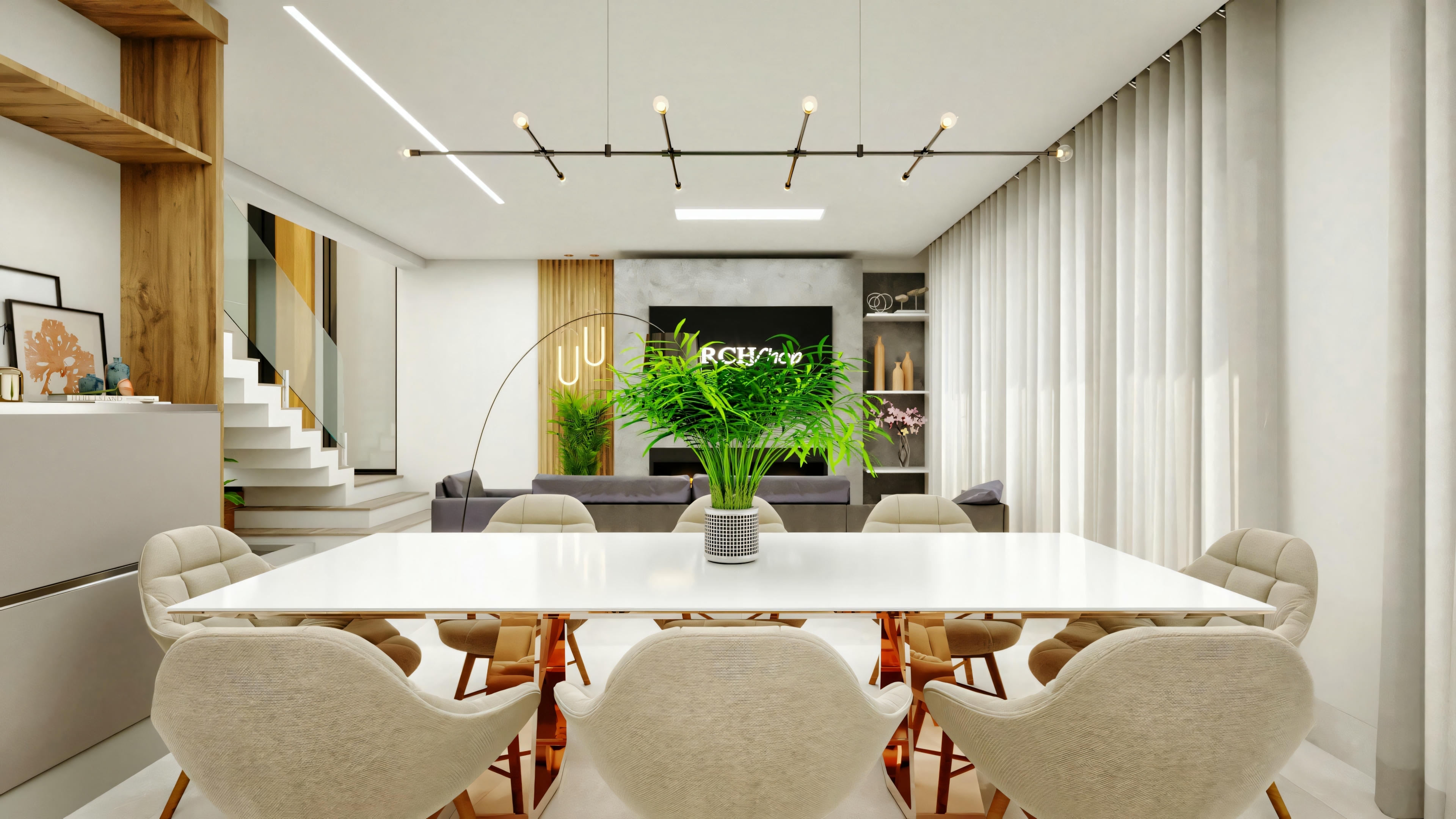 View of the dining room towards the living room in the Project, showing the integration of the environments. Includes dining table, living room with TV and fireplace, and staircase at the back.