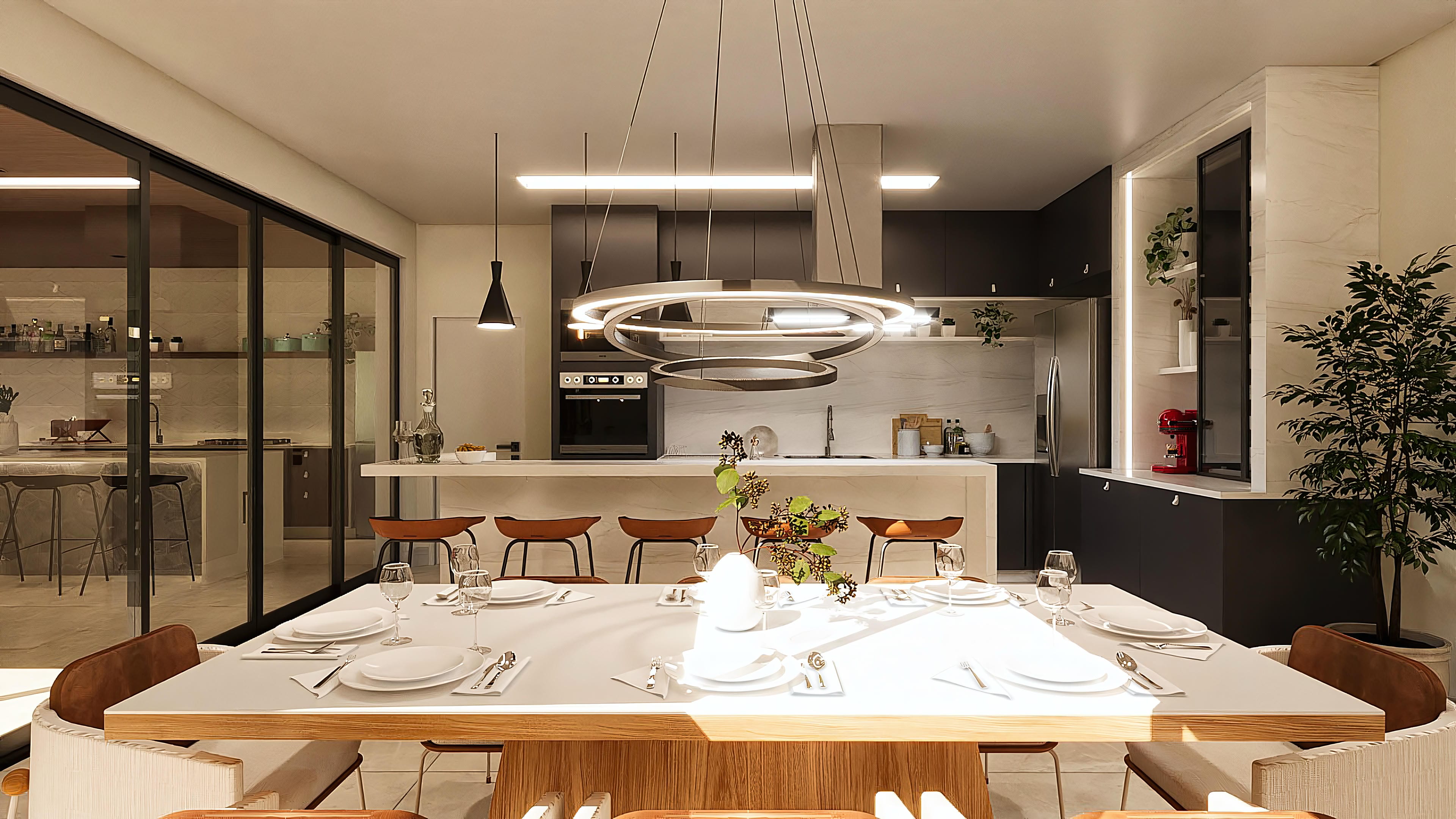 View of the integrated dining room and kitchen of a neoclassical two-story house, with an island, countertop, dark cabinets, and marble details.