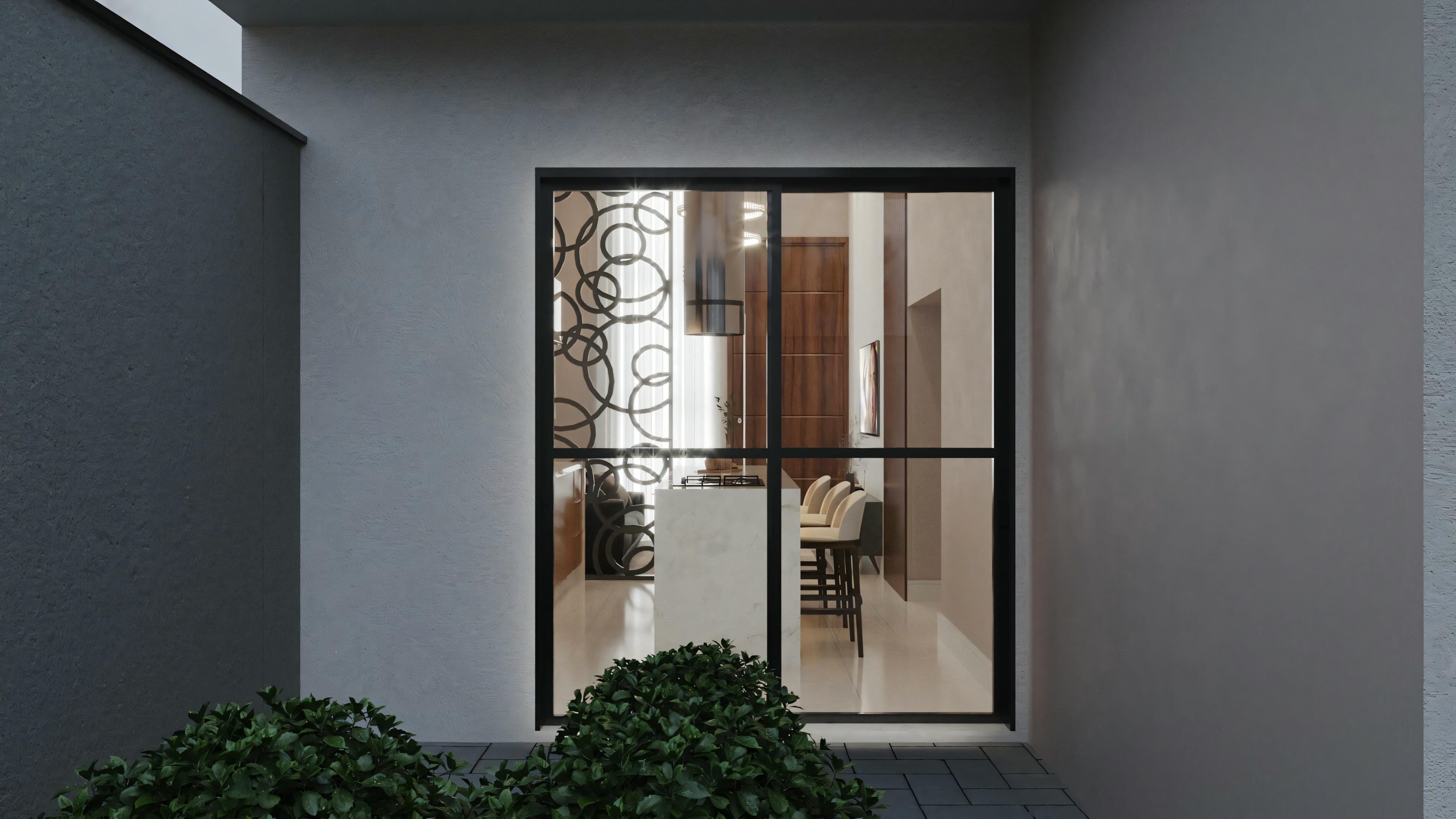 Entrance area with a partially open door, plants انرژی_مثبت, and natural light coming in.