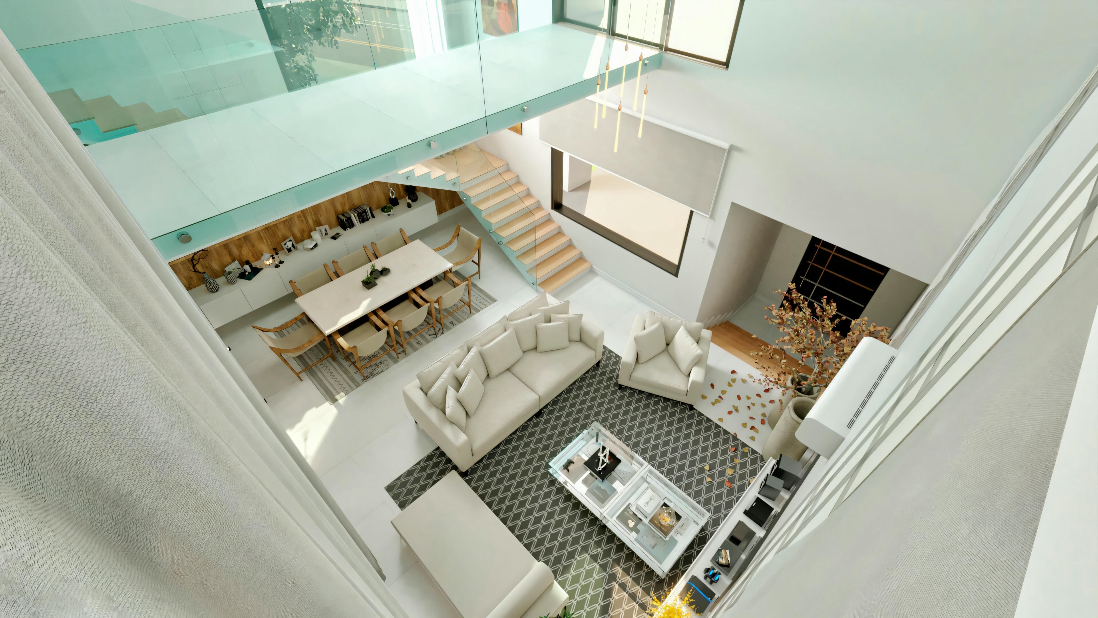 Top view of a modern kitchen and dining room with white furniture and a staircase descending into the space.