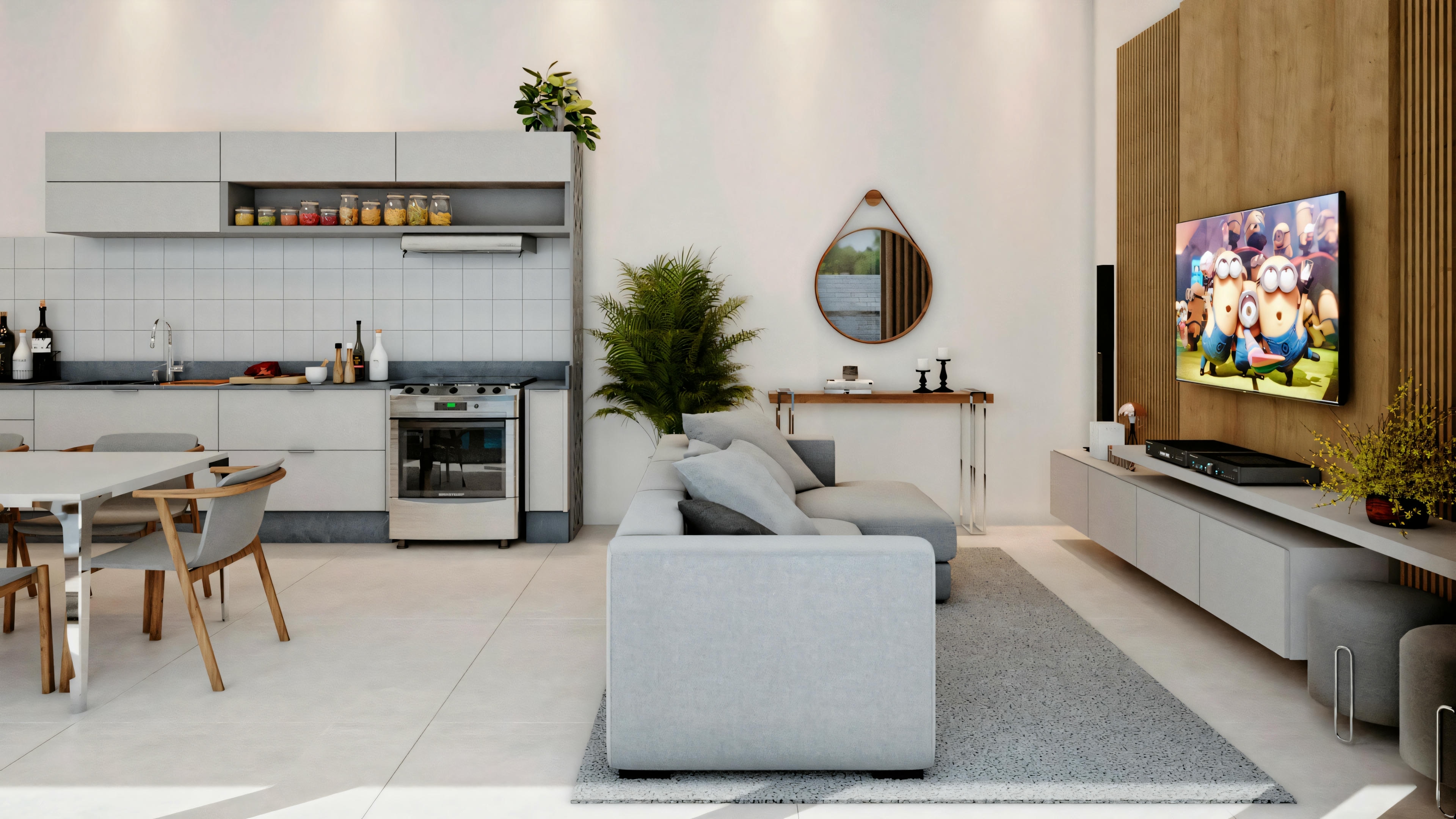 A modern living room with a gray sofa, coffee table, and wall-mounted television, with a kitchen in the background.