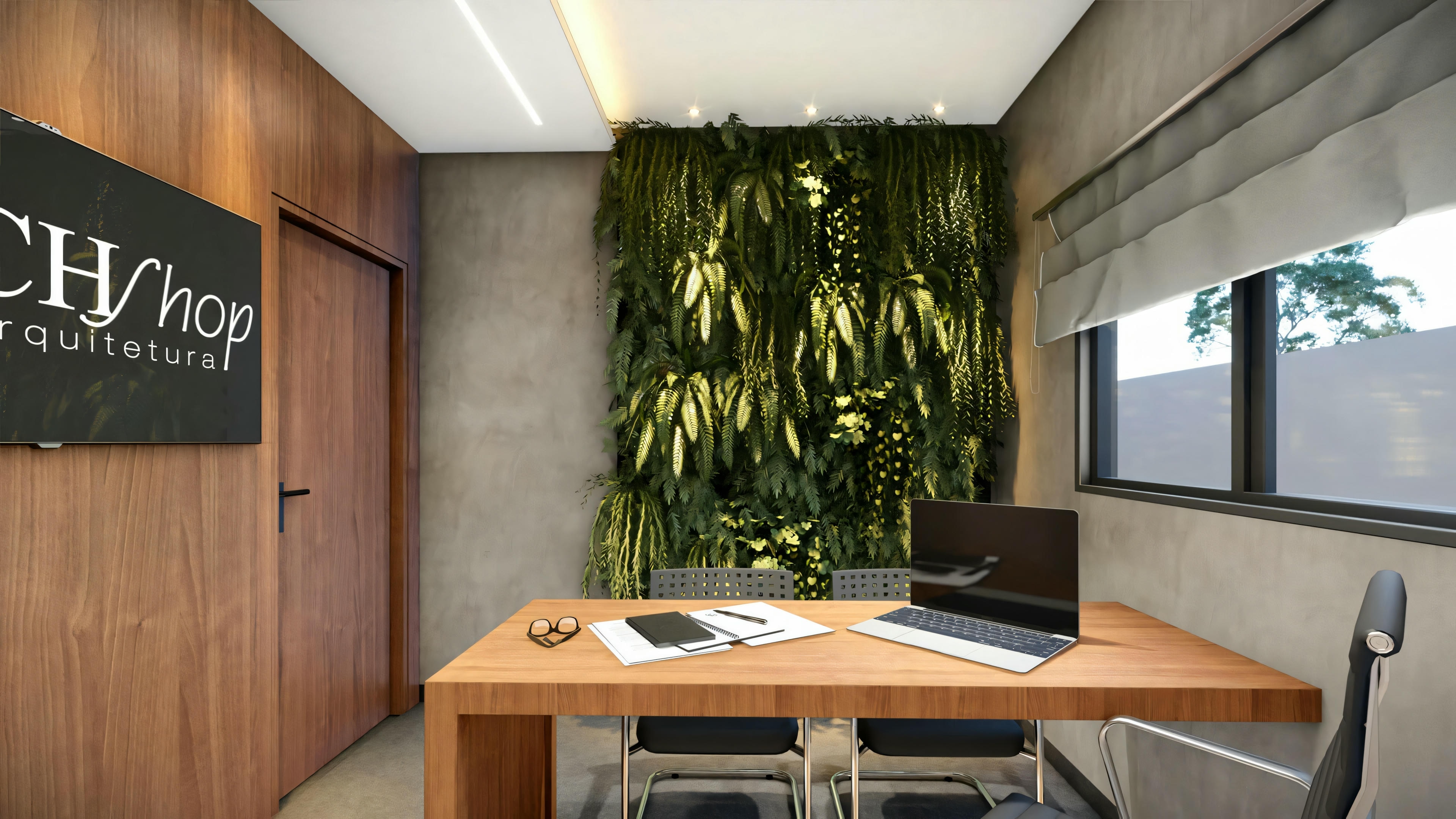 Espacio de oficina en casa con escritorio, silla, computadora y una pared verde decorativa.