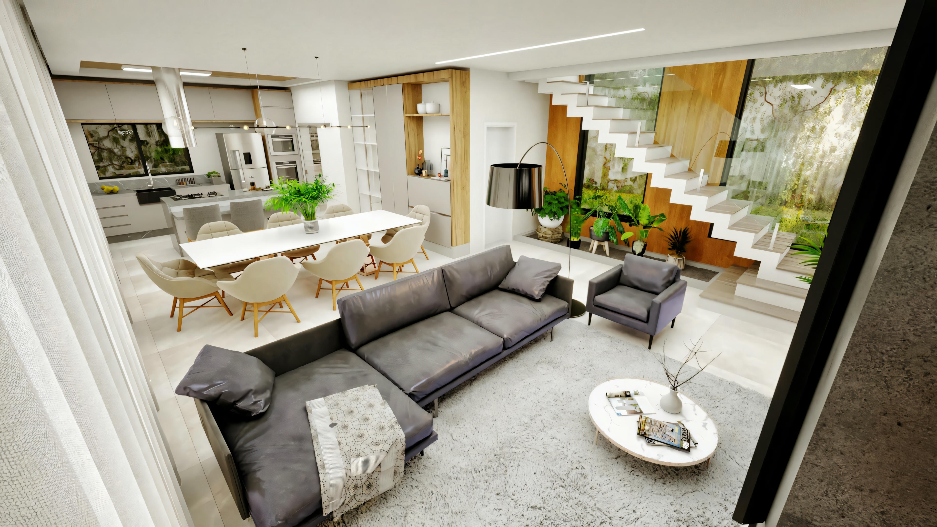 Vista superior del área social integrada: sala de estar, comedor, cocina y escalera con jardín interno en concepto abierto.