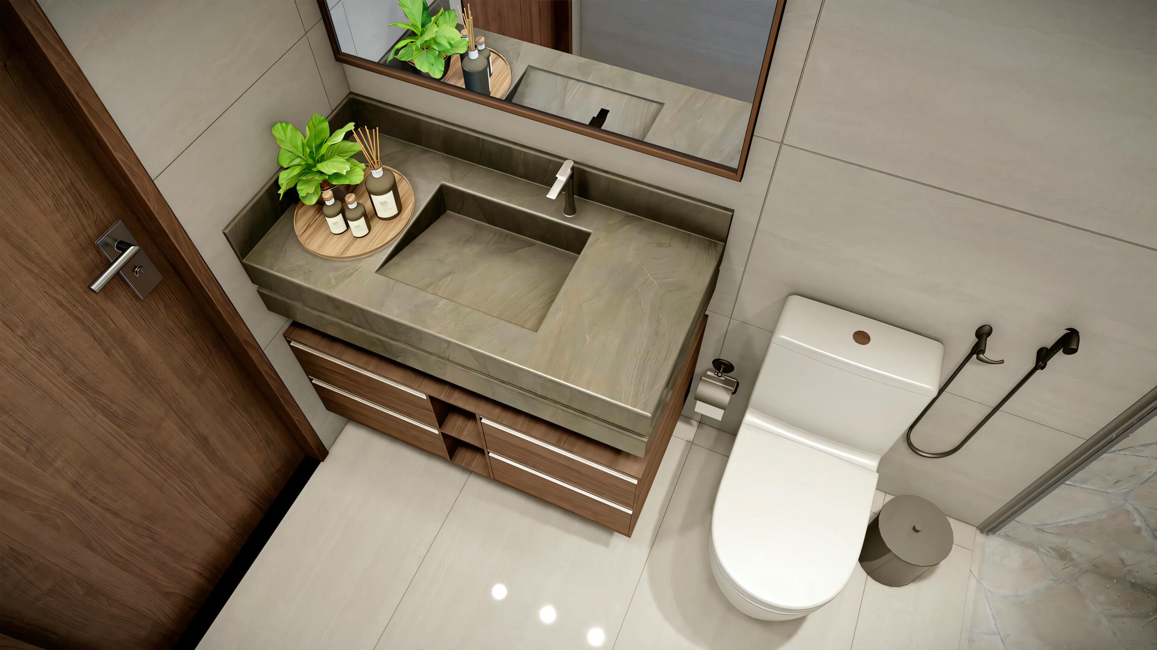 A bathroom with brown wooden cabinets, a white countertop sink, and a mirror above the sink. To the right, there is a toilet with a wall-mounted toilet paper holder and hand towels hanging above.