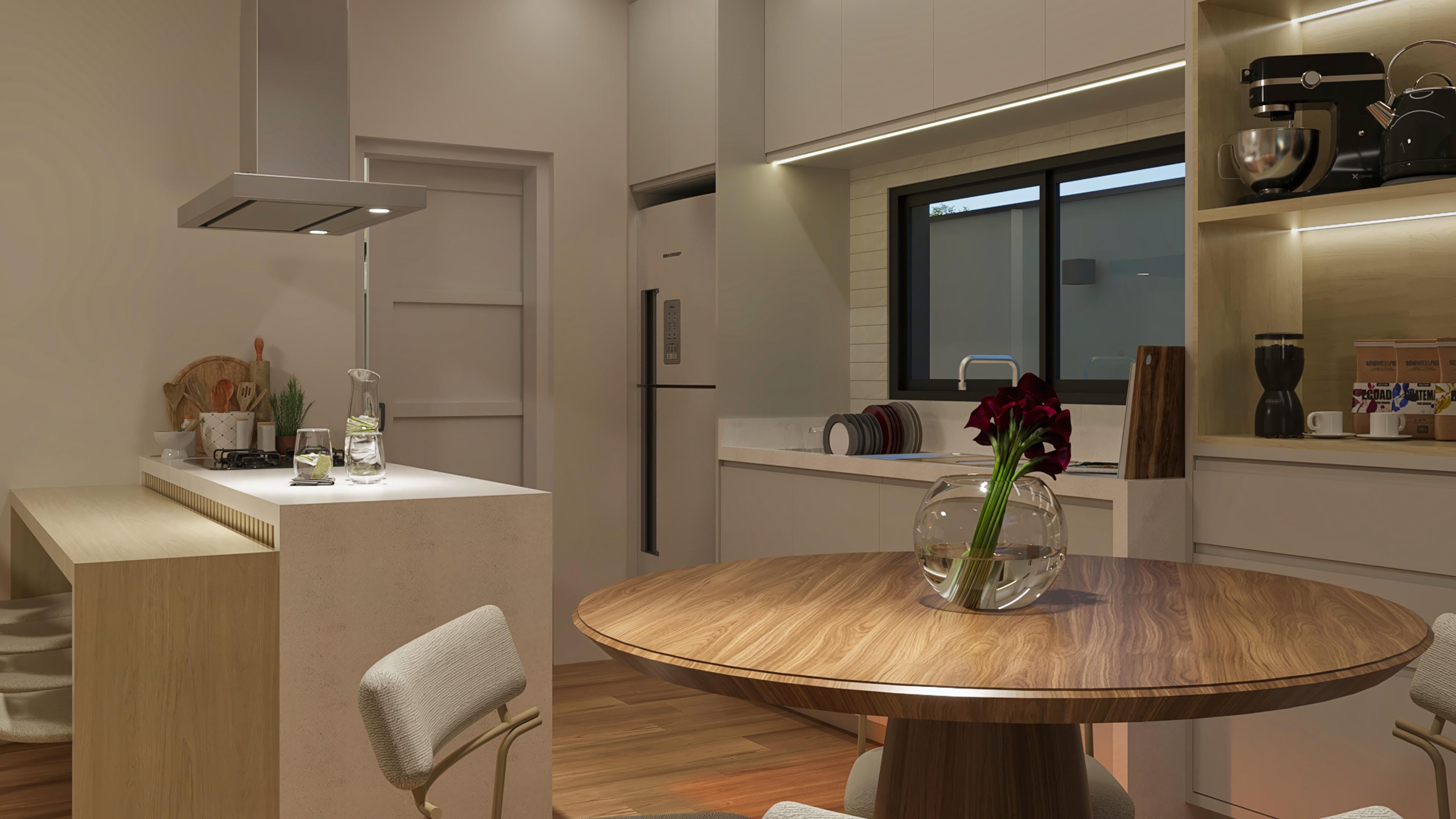 Interior de uma cozinha moderna e funcional com ilha central, balcão em pedra clara e mesa de jantar redonda de madeira. Detalhes em tons neutros e iluminação indireta.