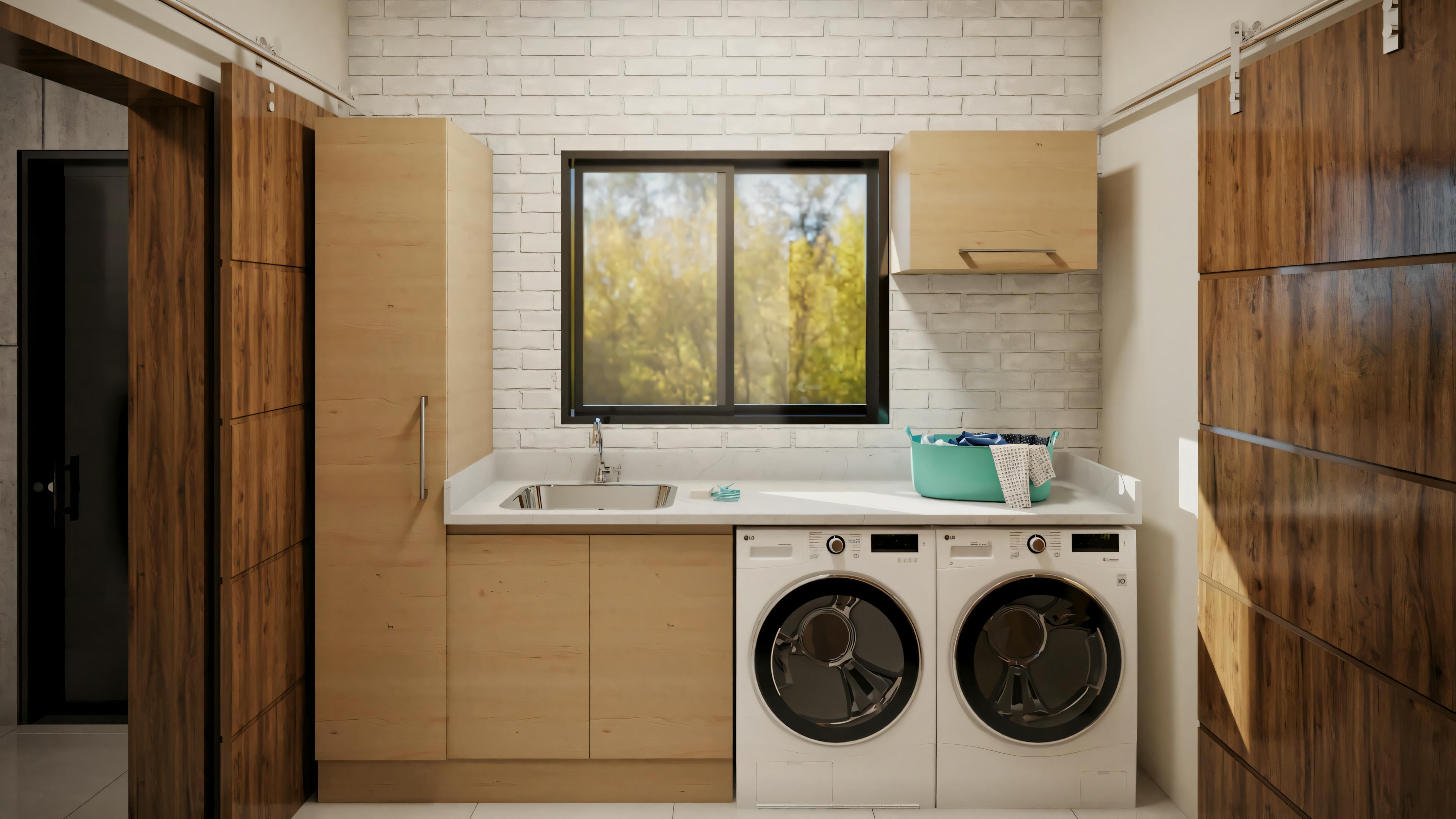 A laundry room with a washing machine, dryer, and storage space.