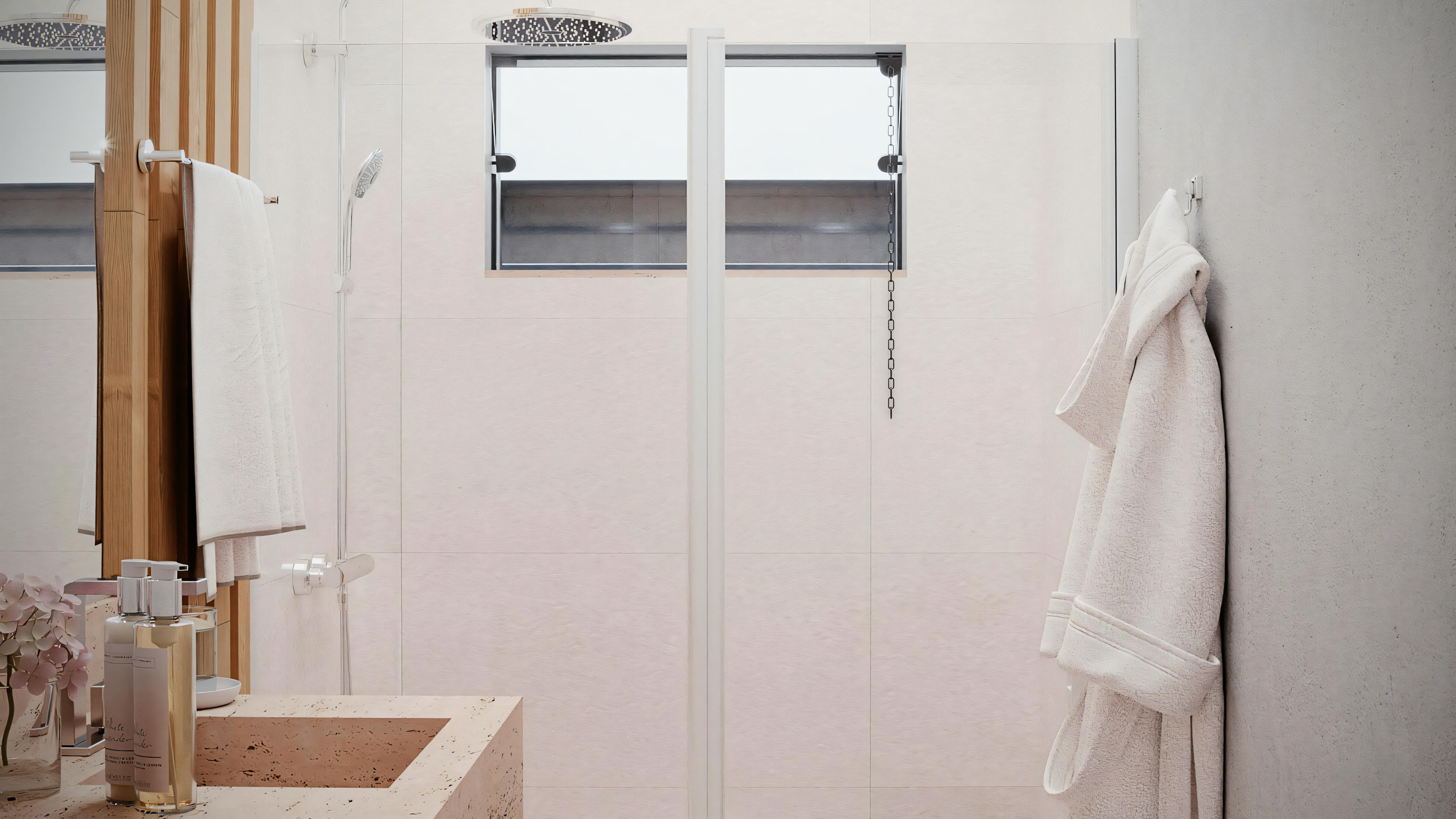 A modern bathroom with a glass shower and white walls.
