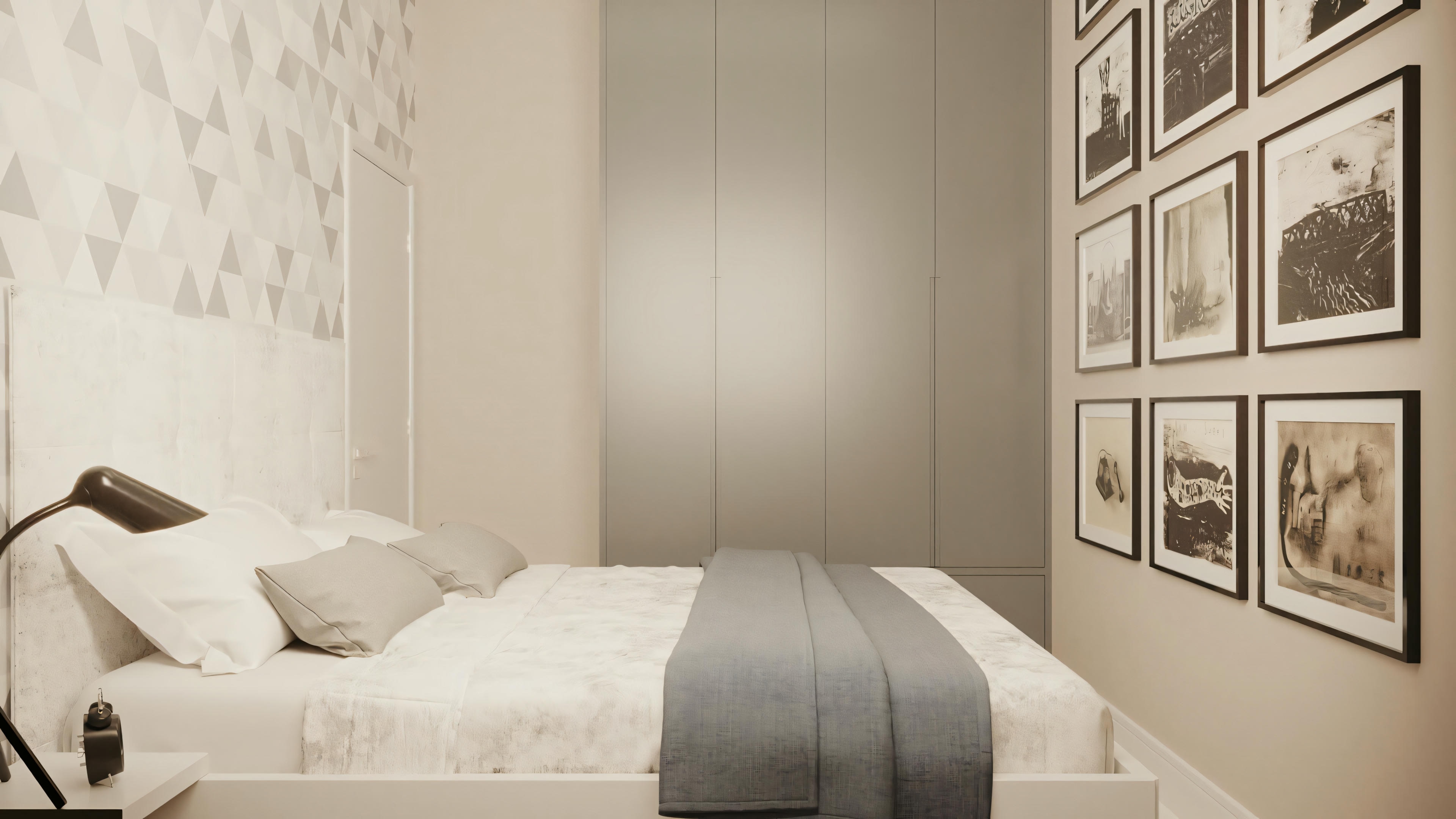 A modern bedroom with a neatly made bed, side table, and frames on the wall.