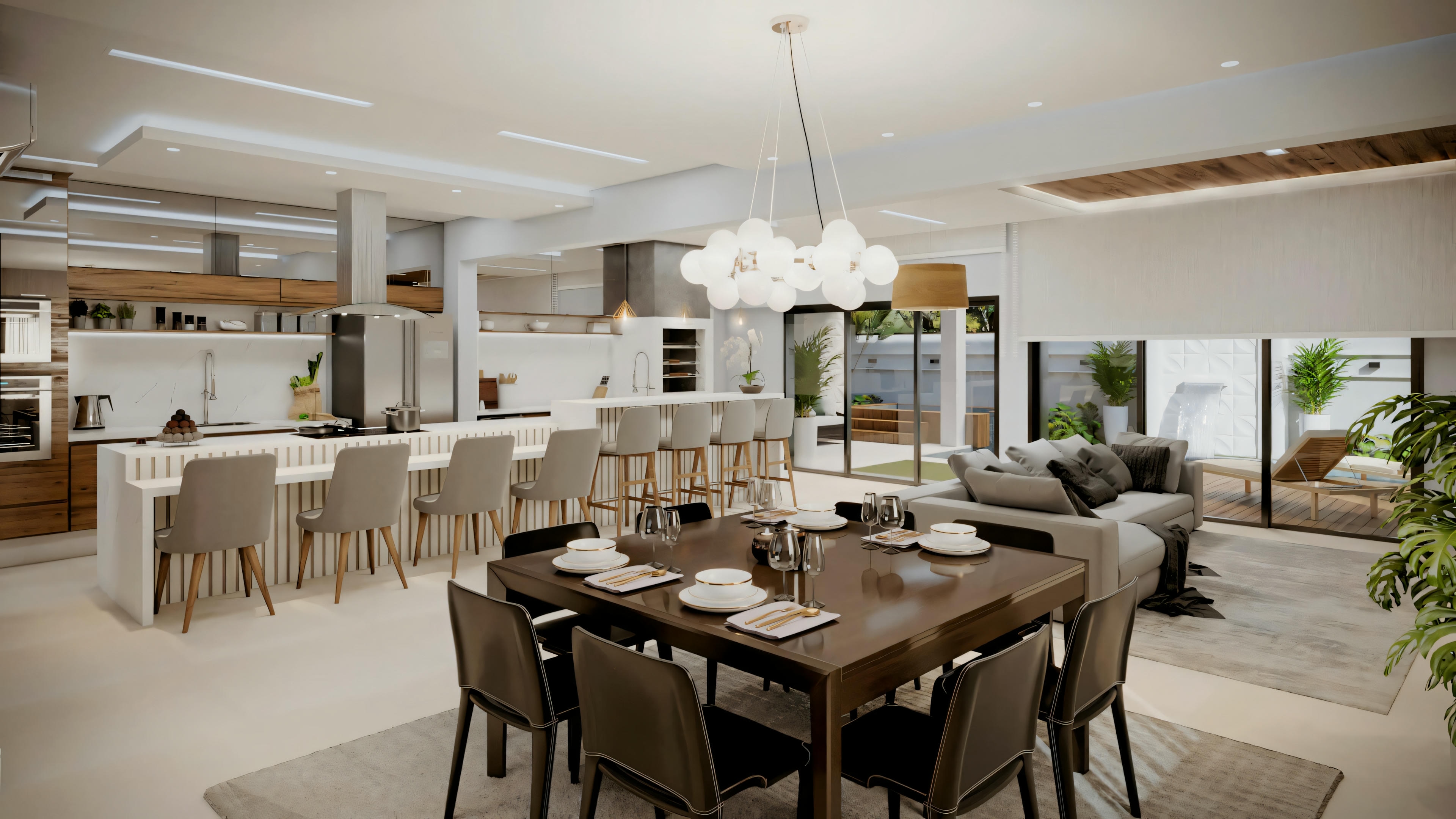 Uma área de jantar moderna levando a uma cozinha com ilha, armários brancos e luminárias pendentes.