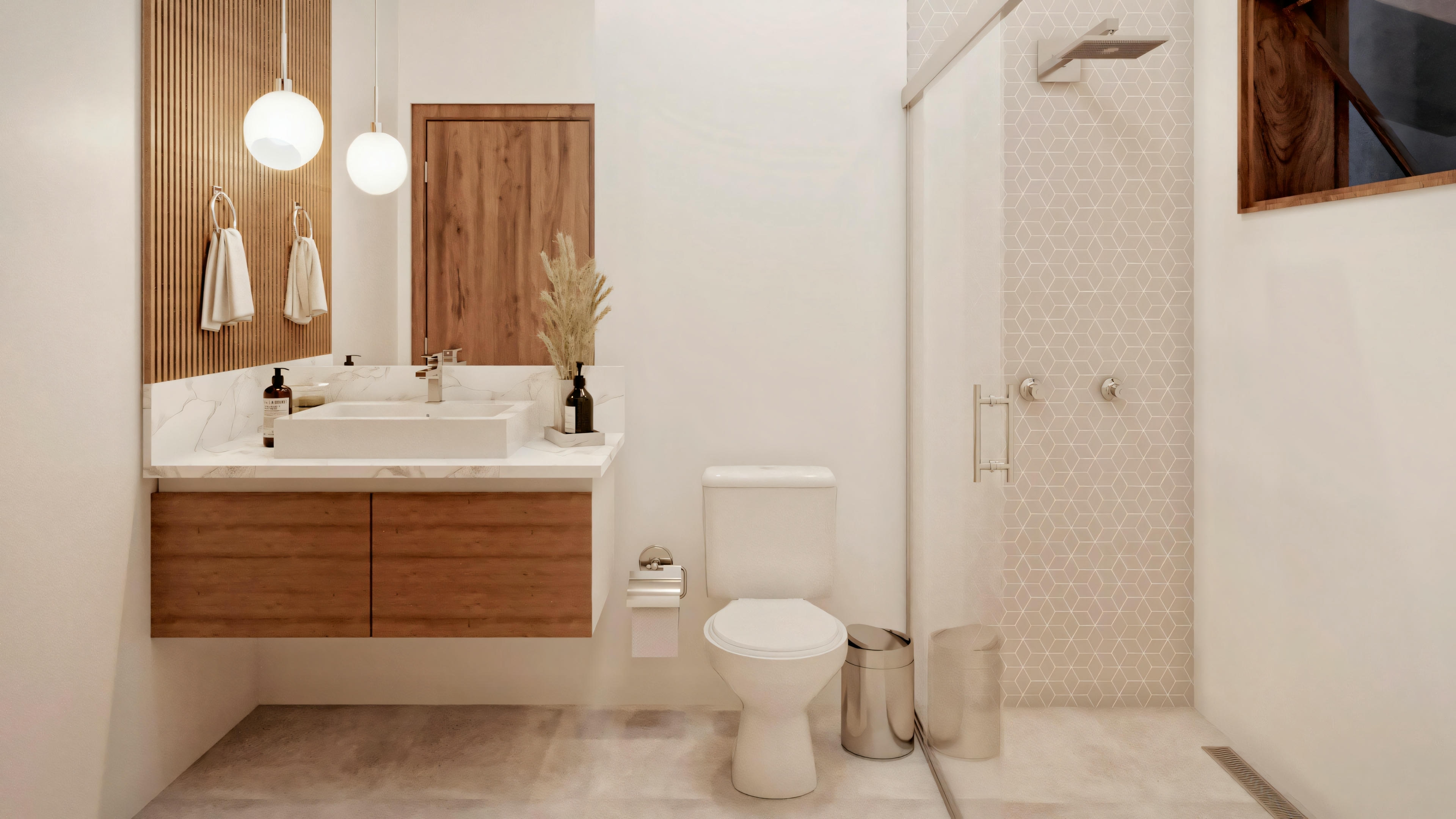 Otro baño con lavabo y espejo iluminado por luces de pared, inodoro a la derecha y área de ducha con puertas de vidrio a la izquierda.