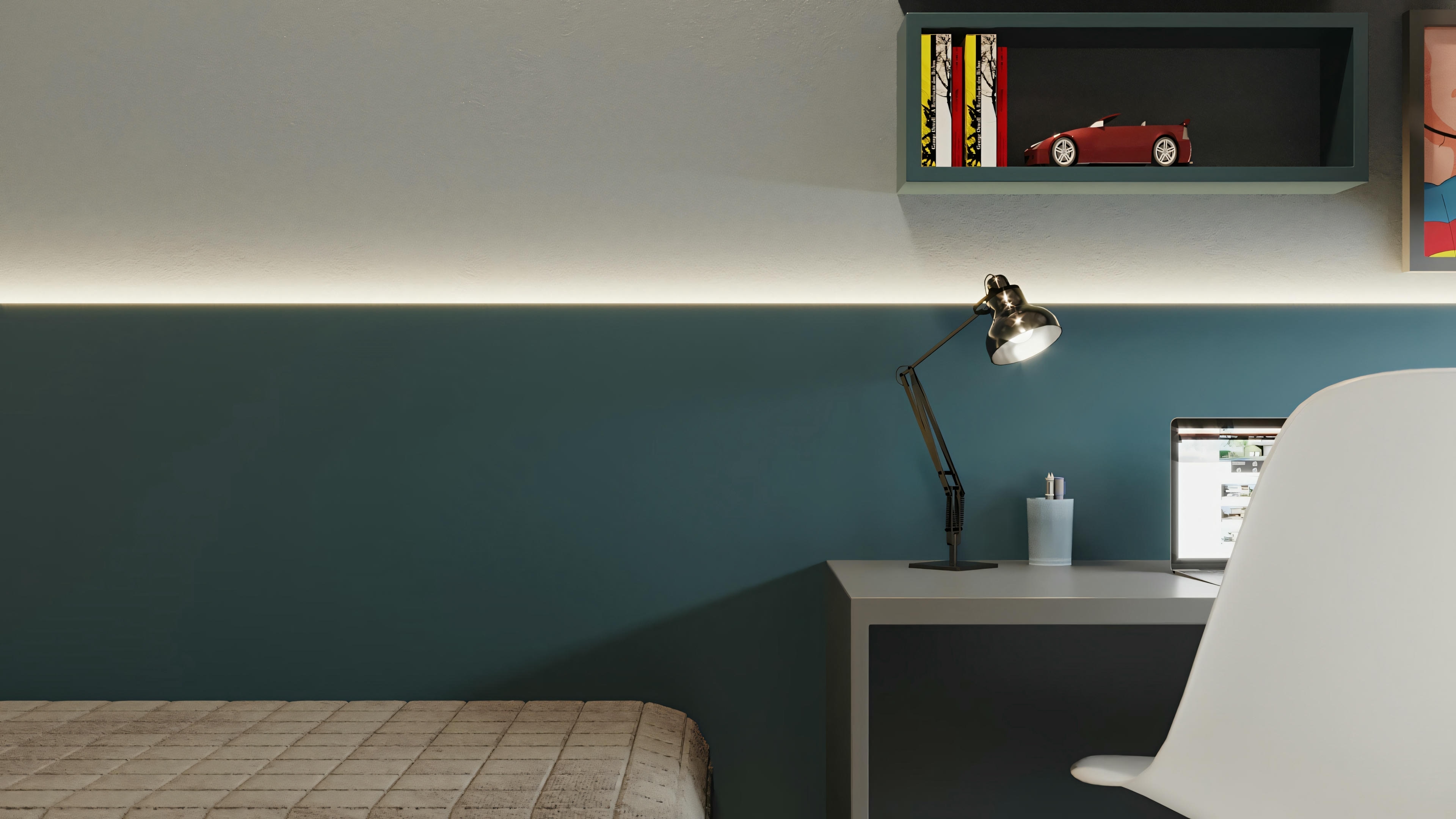 A bedroom with a teal headboard, a small desk with a lamp, and shelves above the desk with books and decorative items.