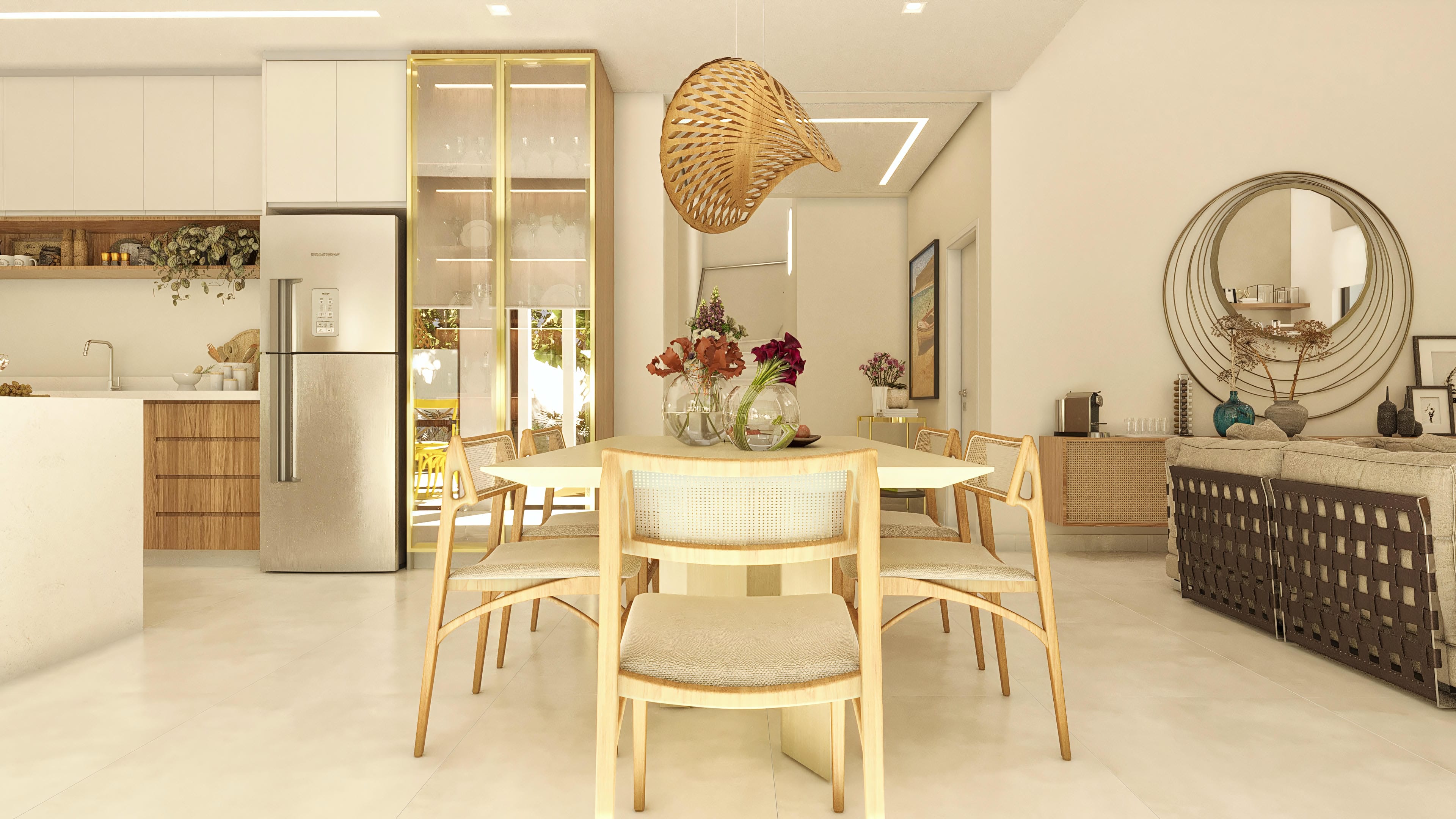 Modern interior of a two-story house with integrated dining room and kitchen. Light wood dining table with straw chairs. Custom cabinets and stainless steel refrigerator in the kitchen. Detail of a decorative mirror and sofa in the living room.