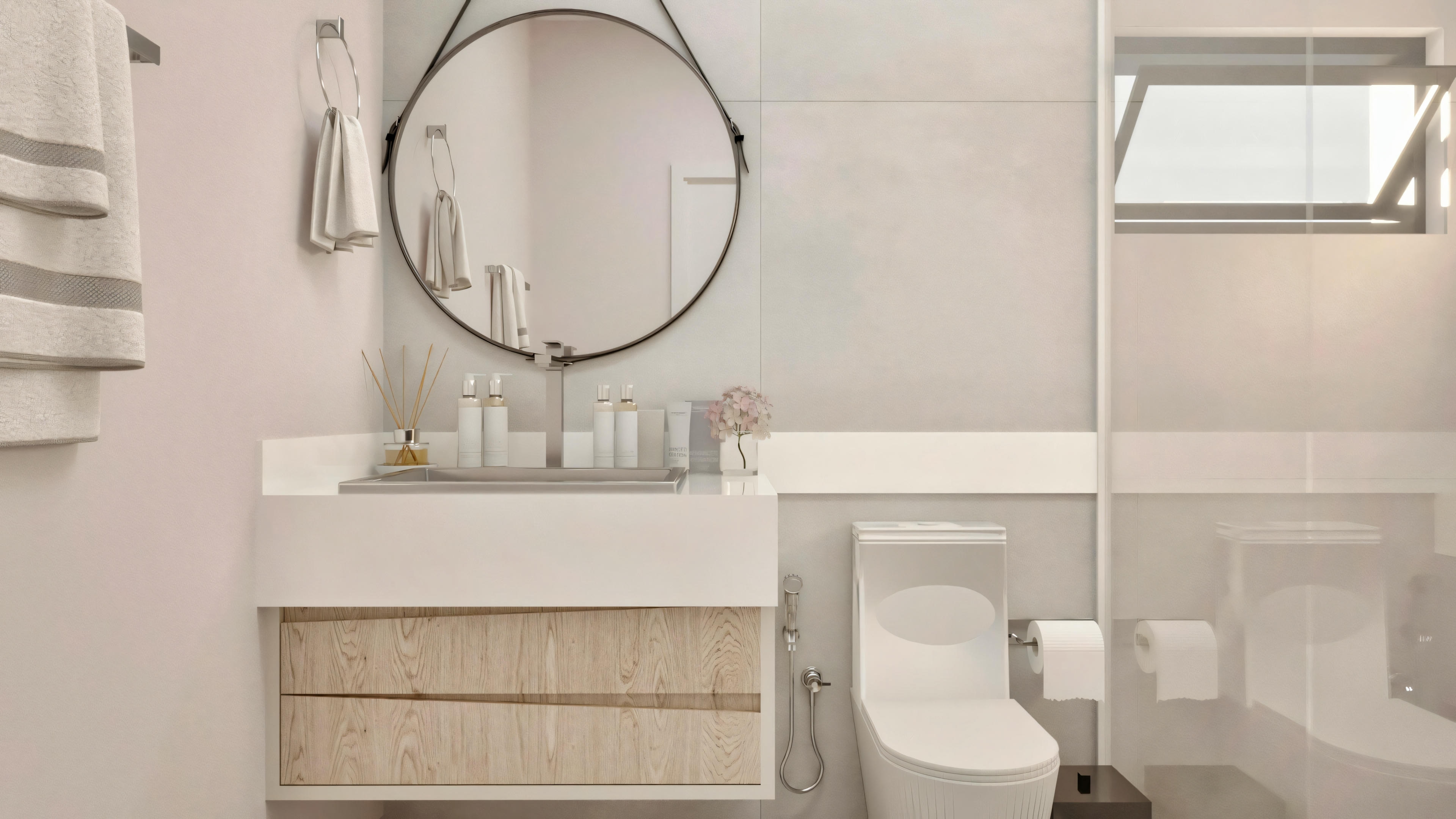 Bathroom with a toilet and a sink with a mirror above, well-lit, likely by natural light.