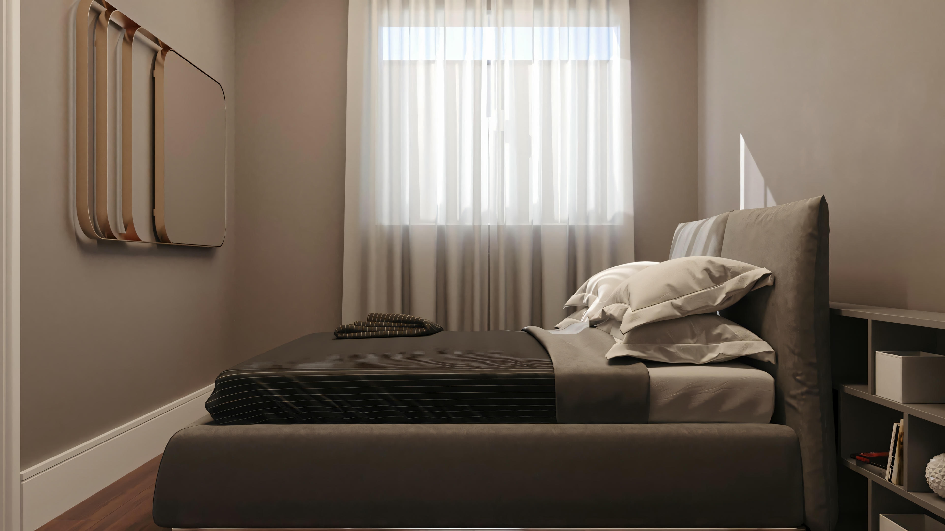 Bedroom with dark-toned bed, white bedding, and a pillow against a light pink wall.