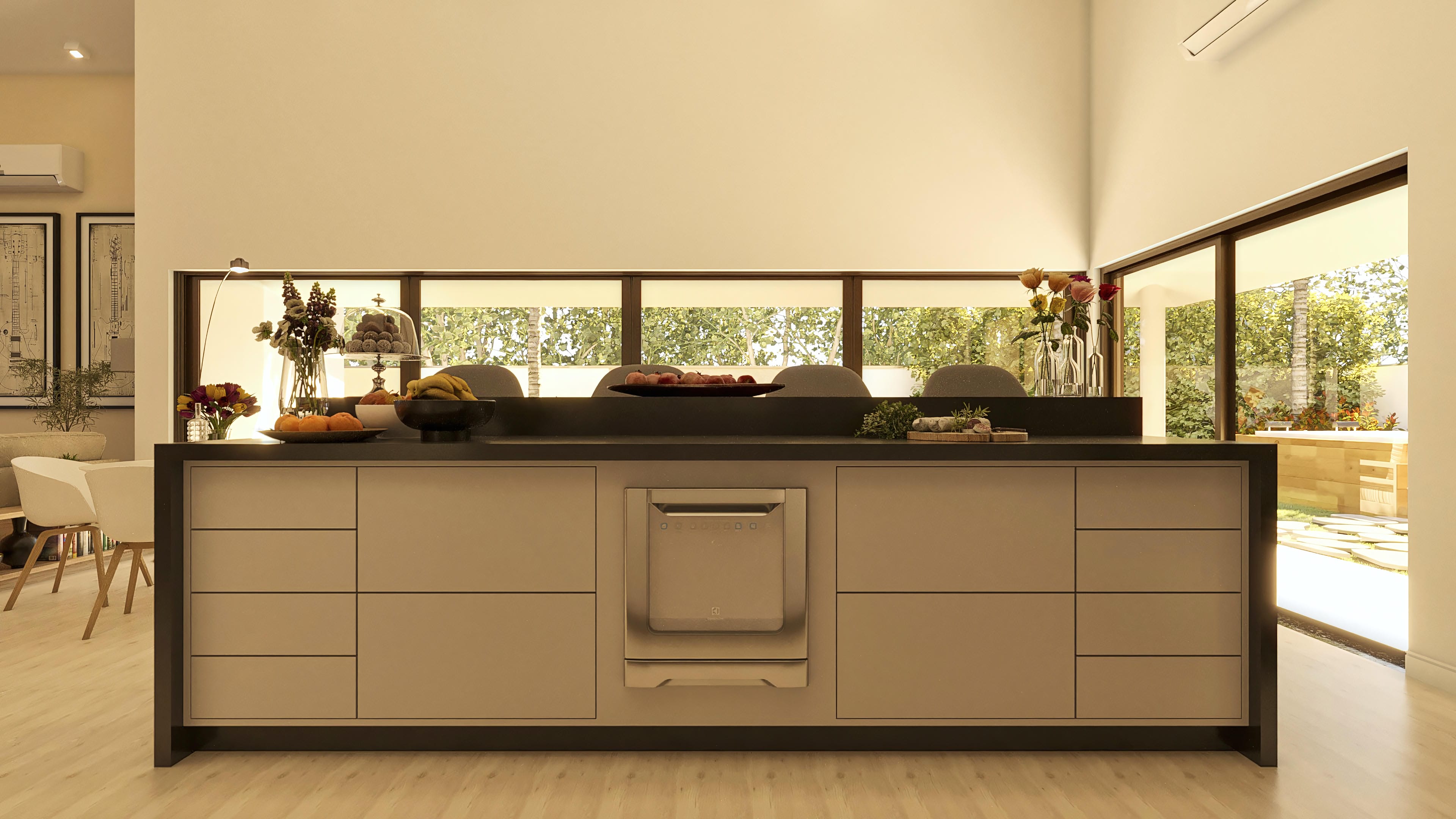 Detalle de la cocina con armarios a medida en tonos neutros, barra oscura y vista panorámica hacia el área externa con hidromasaje.