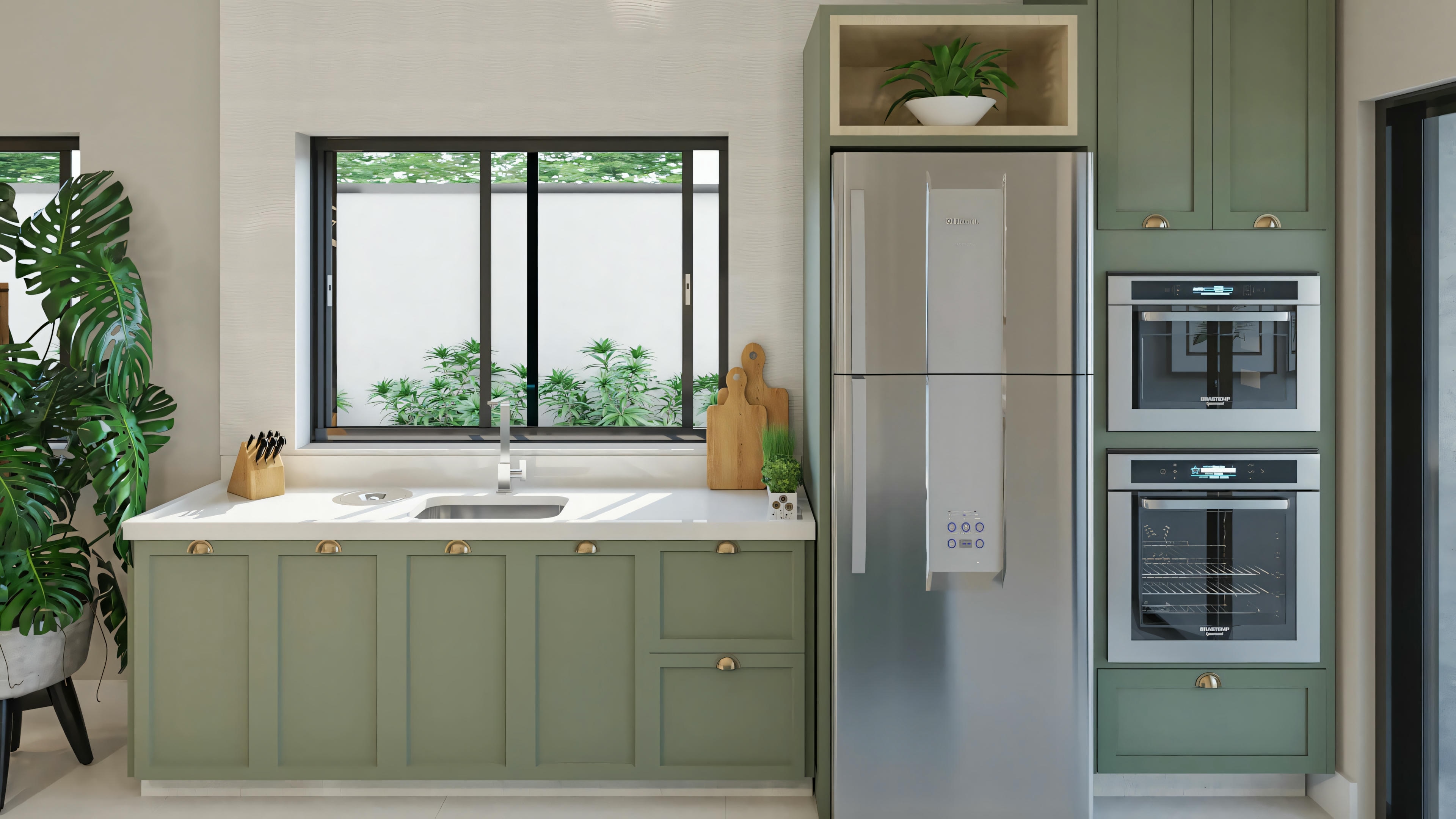 Cocina con armarios verdes, electrodomésticos de acero inoxidable y plantas en la encimera.