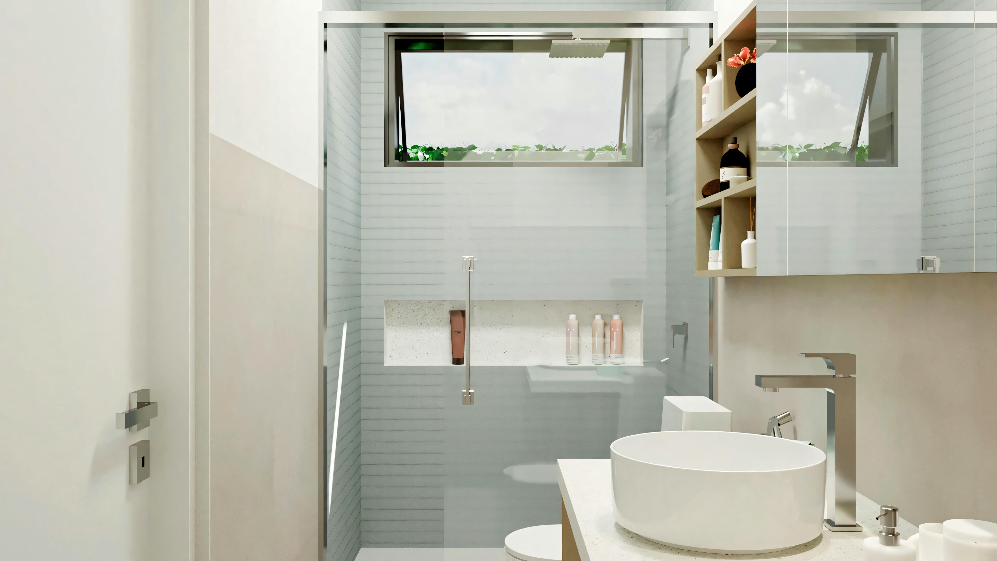 Modern bathroom with sink, toilet, and shower area with glass partition.