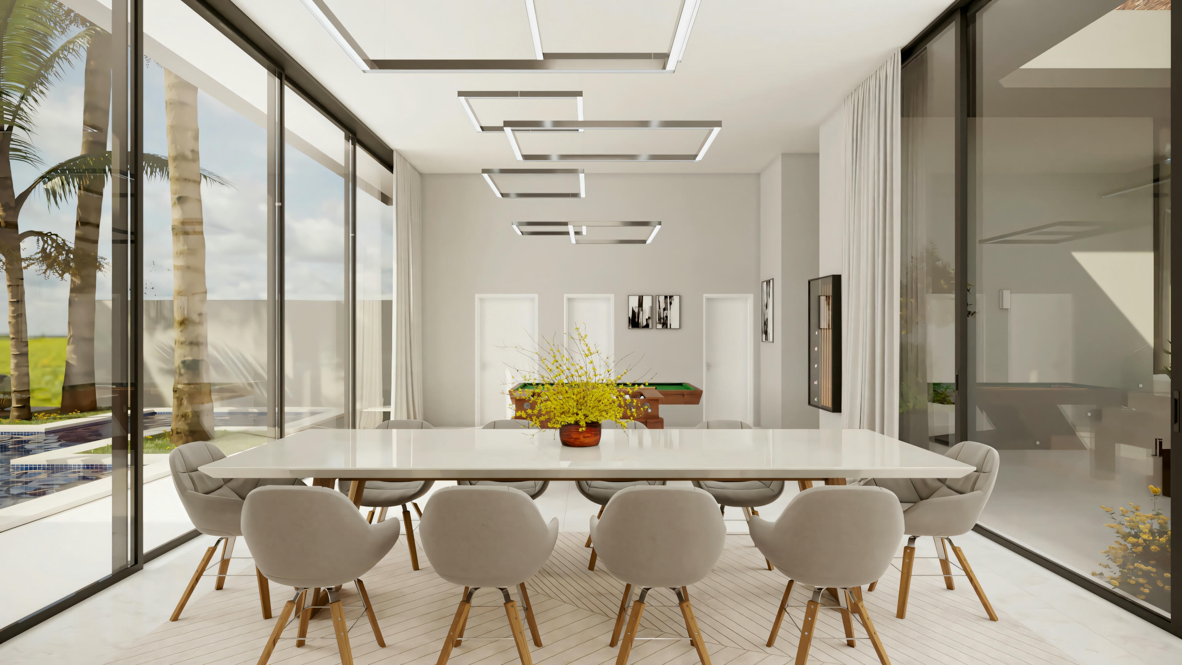 Modern dining room with a large table and chairs, floor-to-ceiling windows overlooking the outdoor green area.