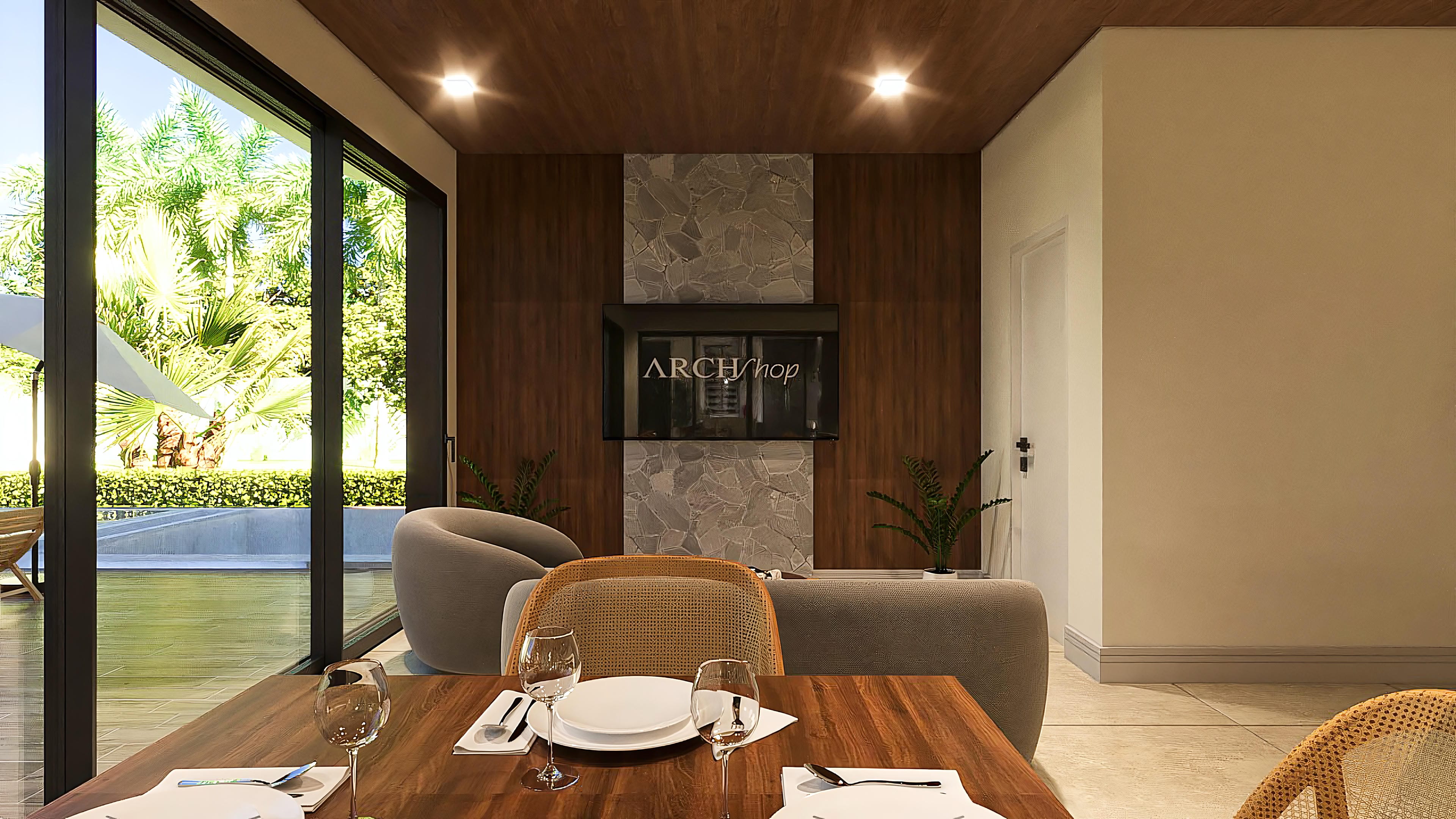 Internal environment with wood details, stone, and elegant furniture, with a view of the outdoor area with a pool and lush landscaping.
