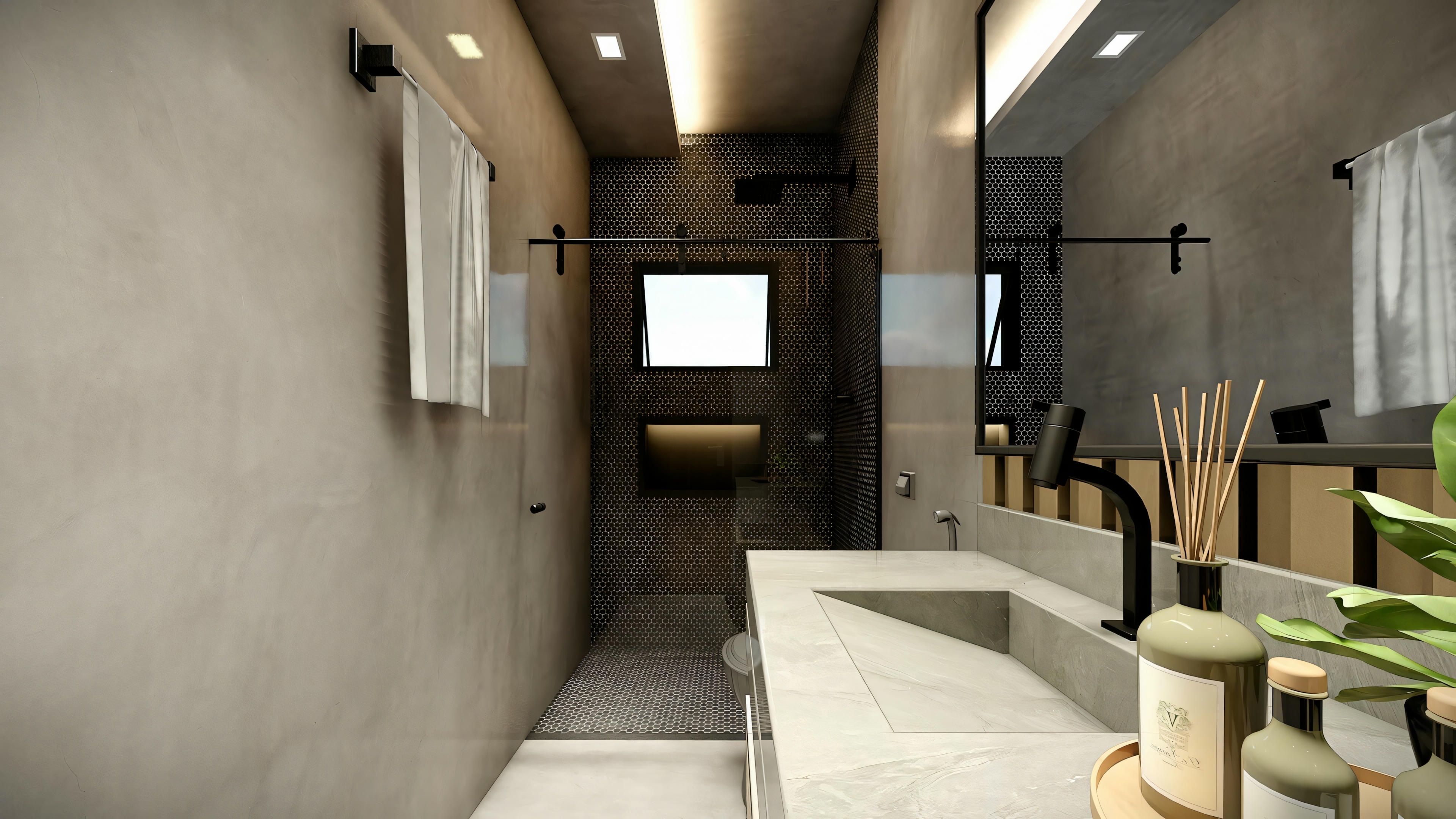 A modern bathroom with a long countertop, a sink, a large mirror, and various toiletries organized on the countertop. There is also a towel rack with towels hanging on the right.